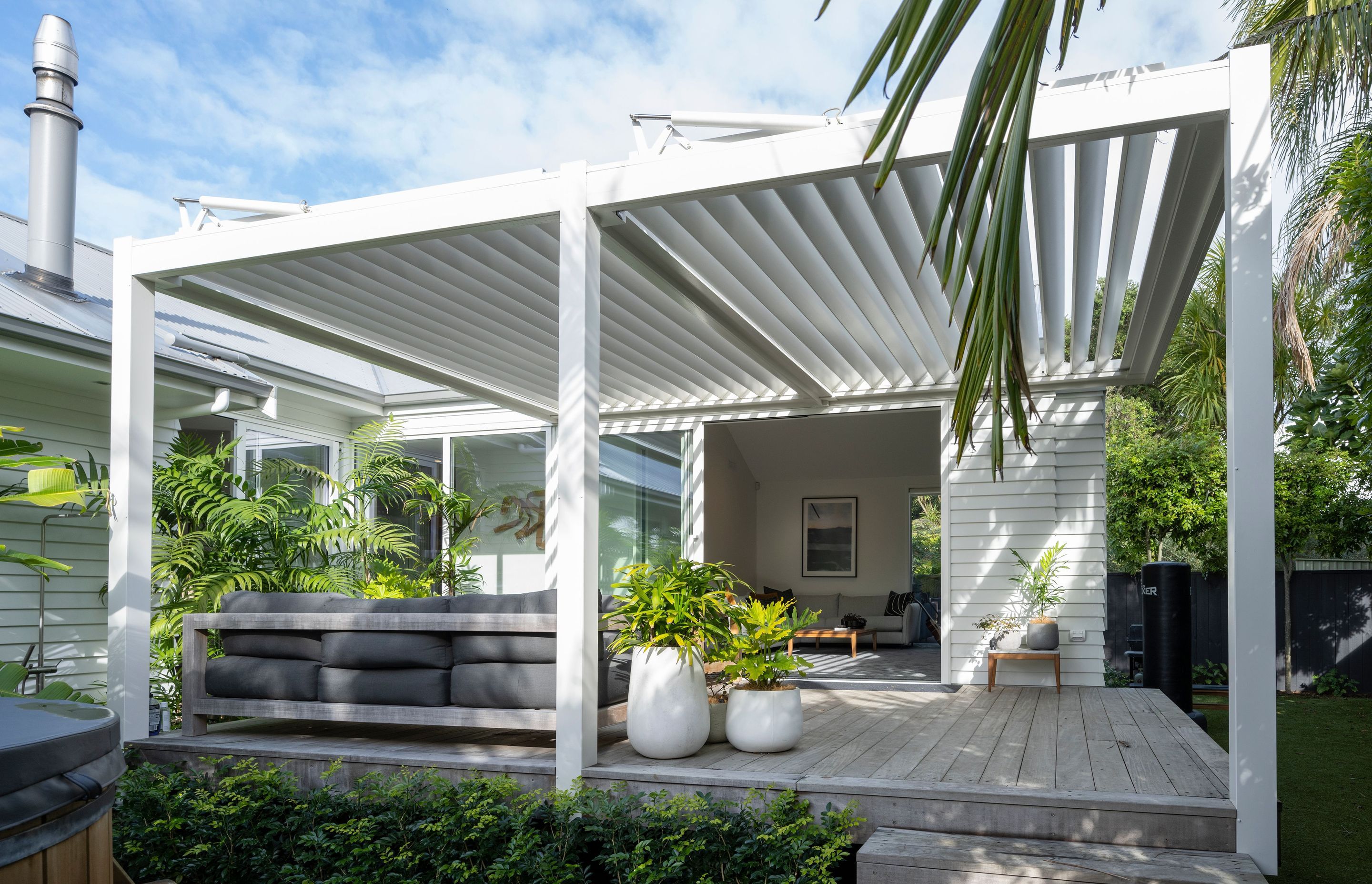 Auckland Home Project. Louvre Roof and Gate Create Oasis of Tranquility
