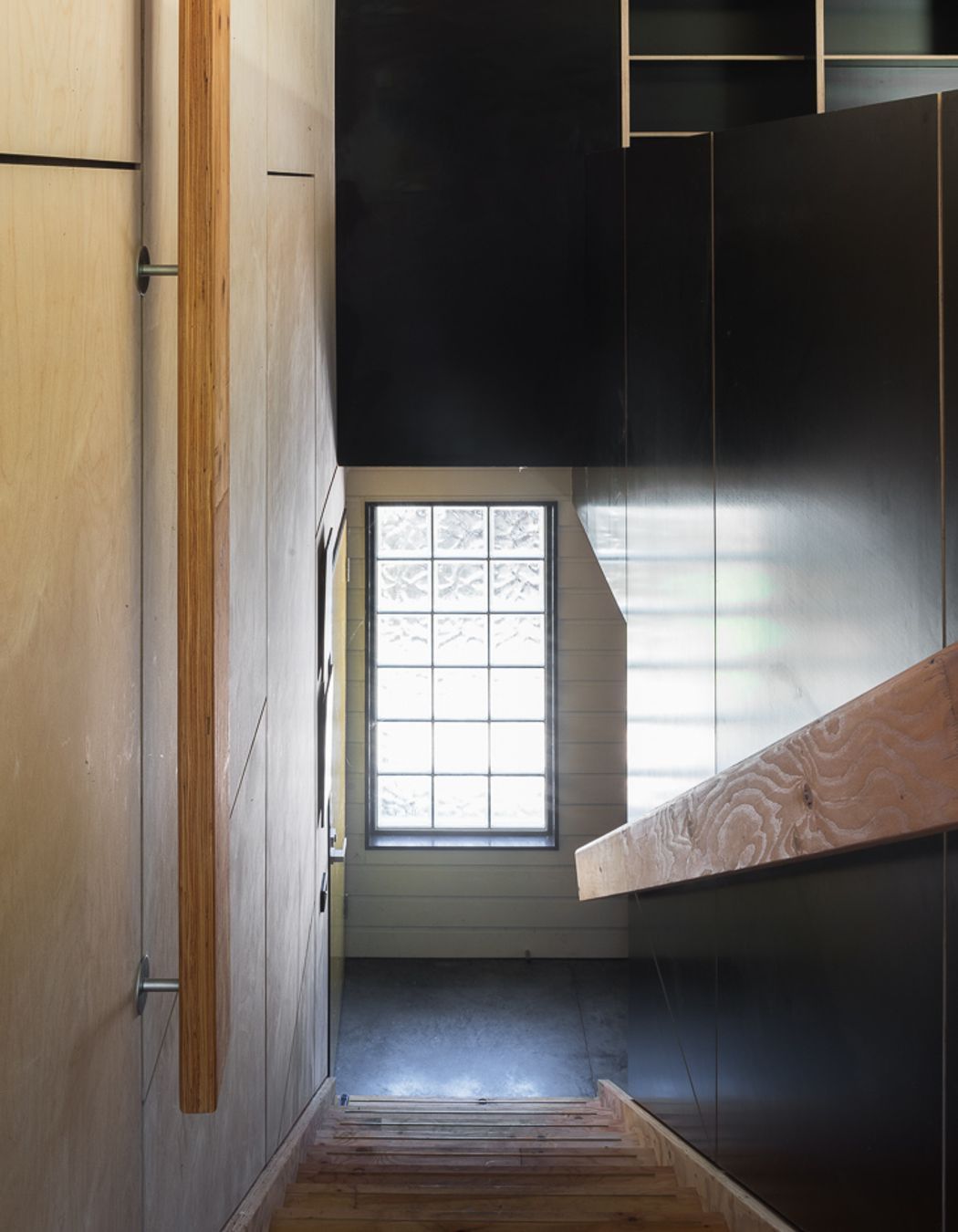 Hardwood stairs, glass brick window, Shoreham Studio
