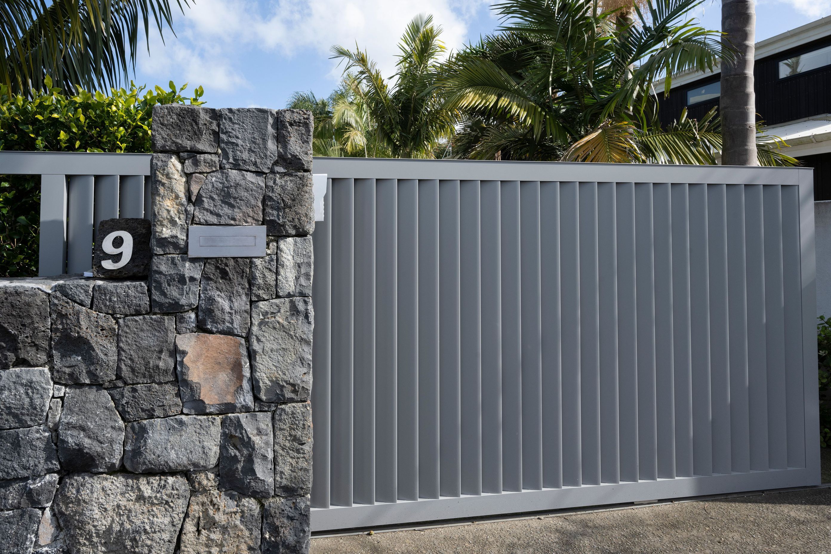 Auckland Home Project. Louvre Roof and Gate Create Oasis of Tranquility