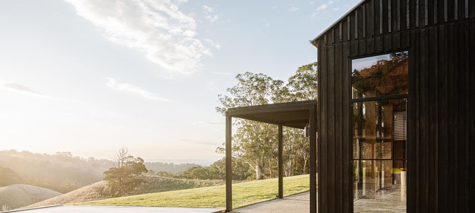 CUTEK® protects and enhances the natural beauty of Yellow Stringybark cladding on this West Gippsland barn-style home, using CUTEK® Extreme CD50 and Black Ash Colourtone banner