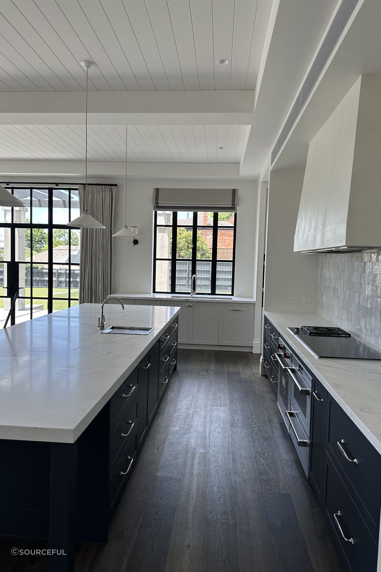 Kitchen - Featuring an automated roman blind.