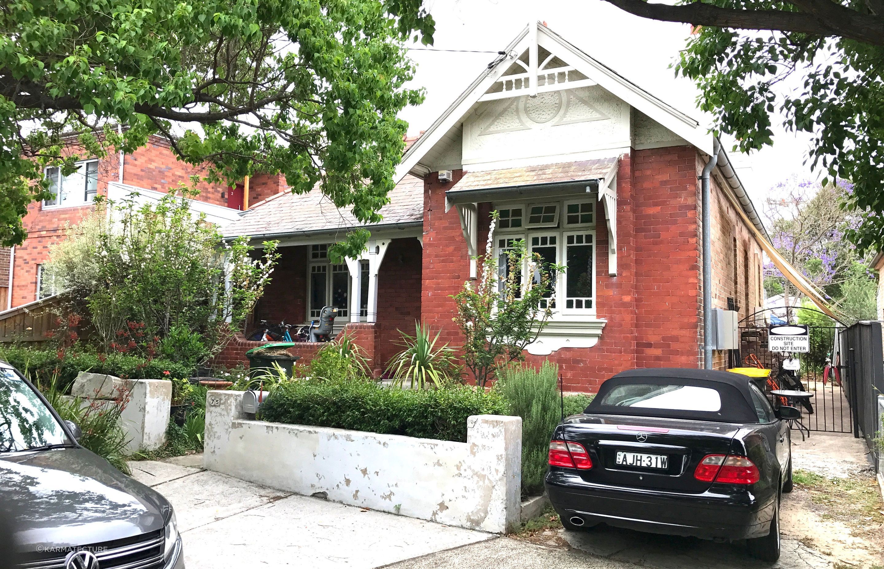 Before the work commenced. Shade sails down the side driveway to mitigate western sun heating up brick cottage