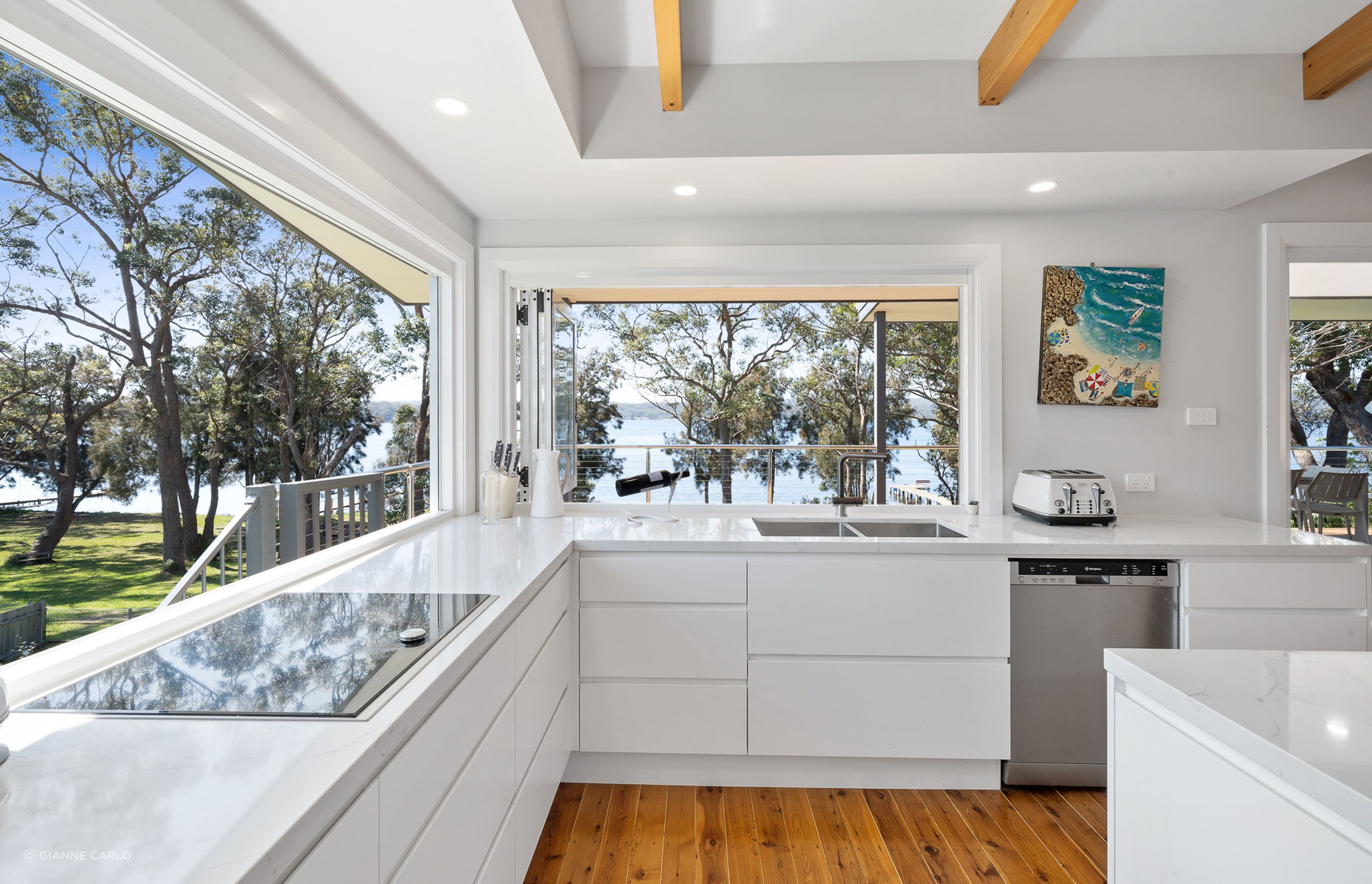 The playful bi-folding doors from the kitchen and large picture window make the kitchen the heart of the home and the views.