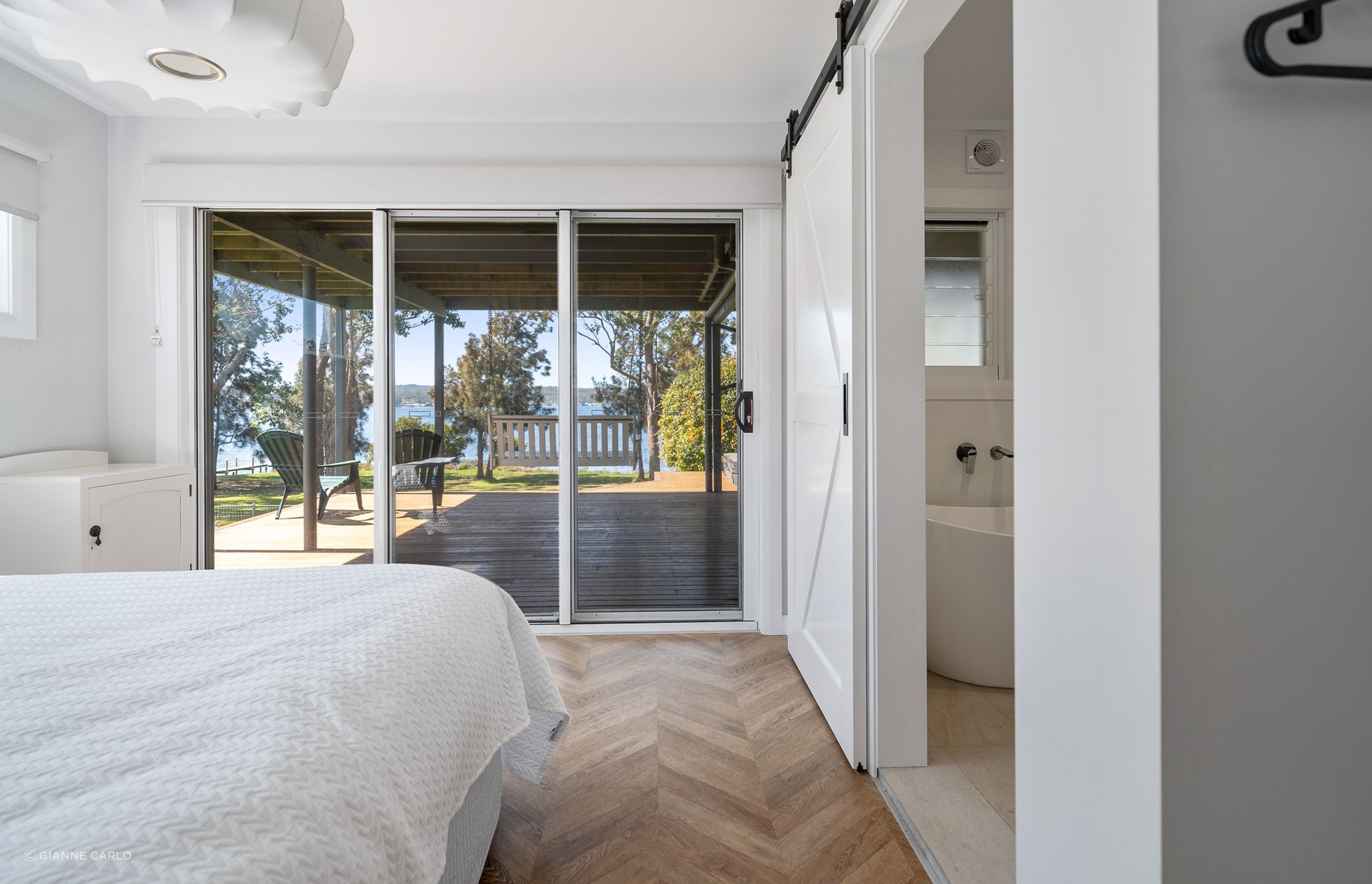 Warm timber floors throughout ground the interiors of this house.