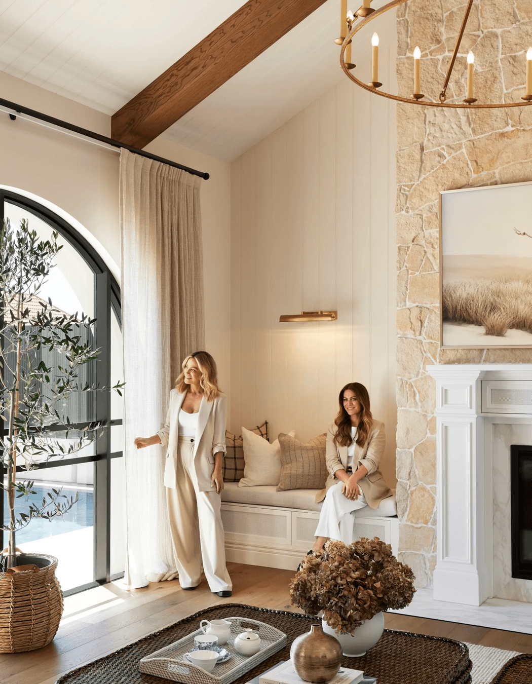 alisa-and-lysandra-brighton-bungalow-fireplace-arched-windows-sheer-curtains-67a02f2eaf2b7.png