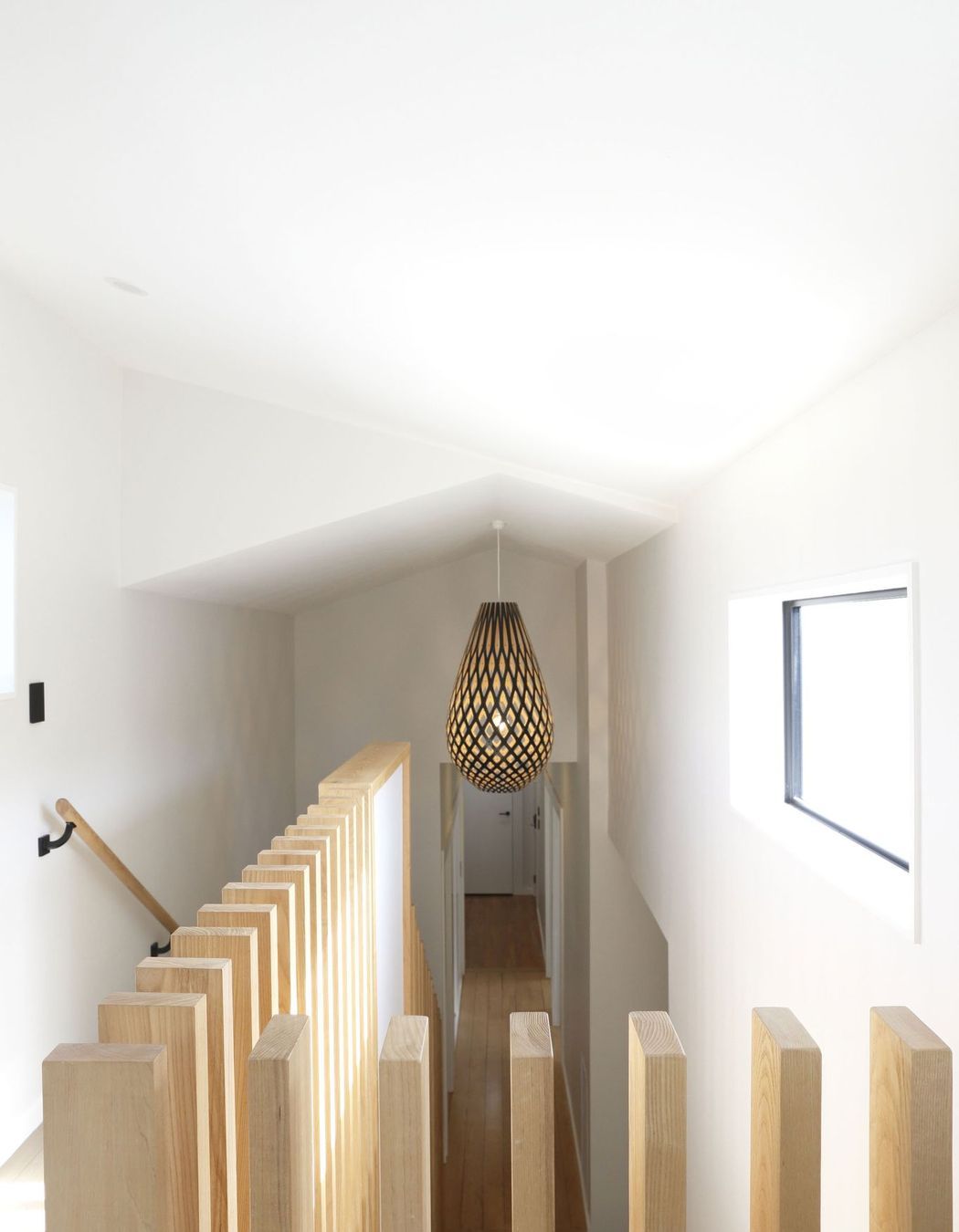 Hallway transition with a contemporary ceiling