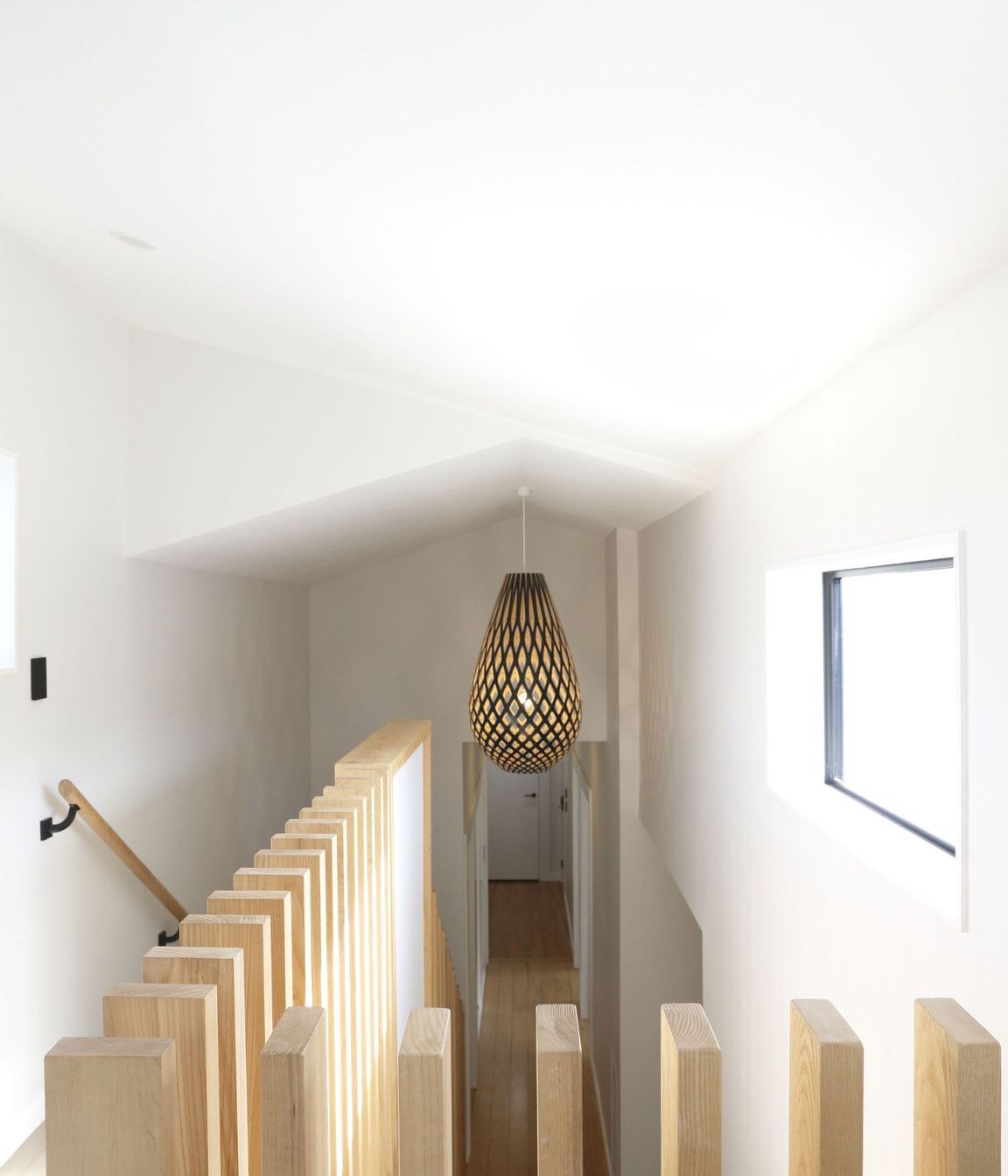Hallway transition with a contemporary ceiling