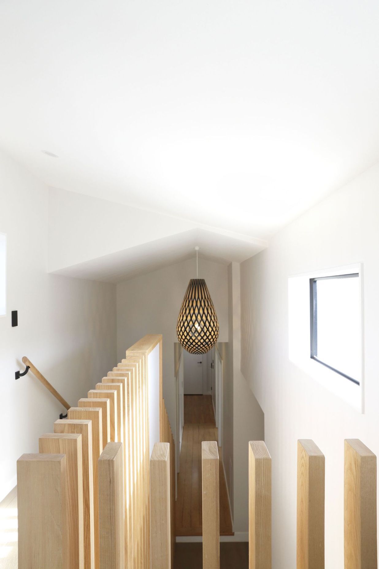 Hallway transition with a contemporary ceiling