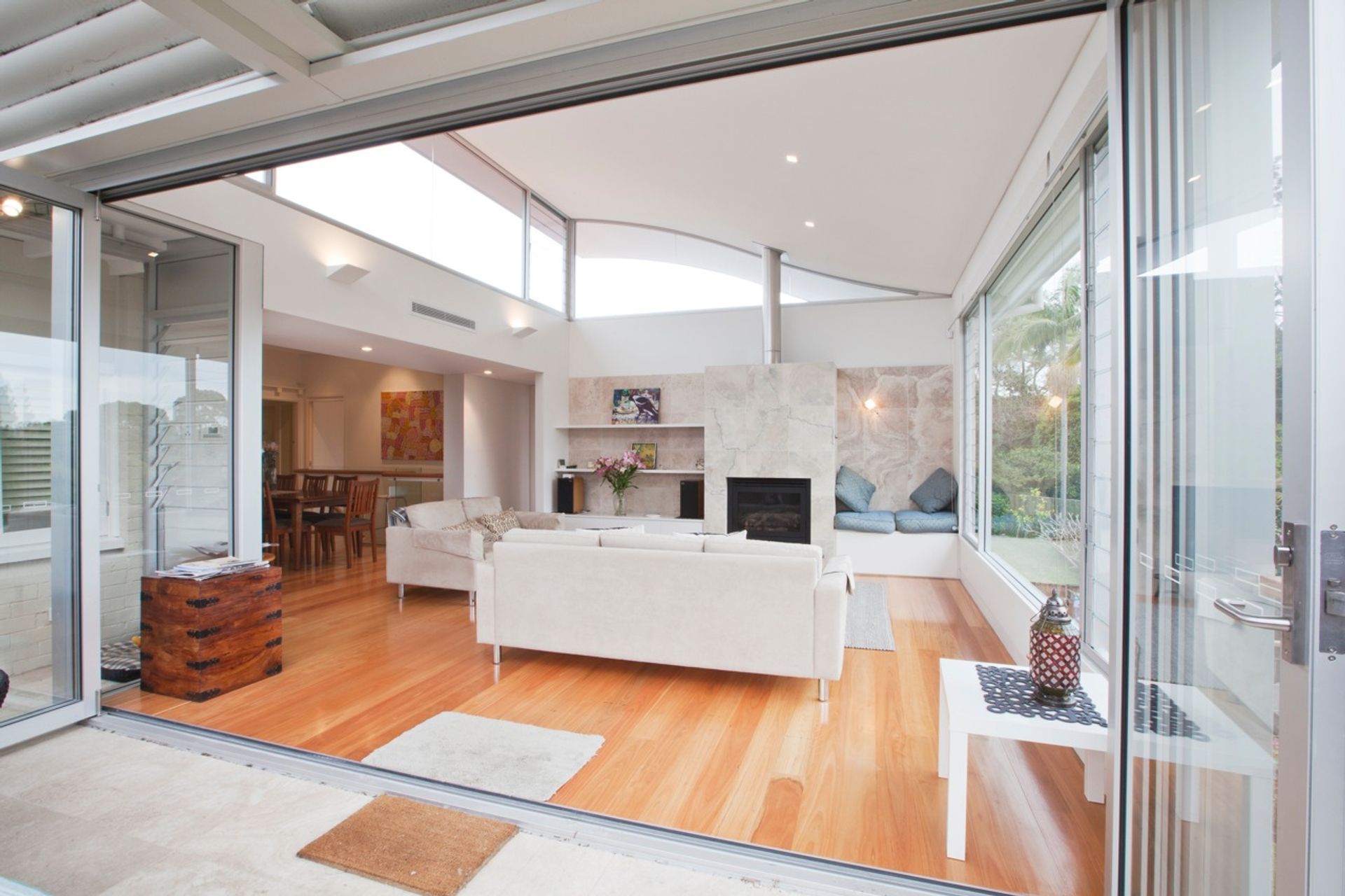 new living addition with curved roof and high level glazing