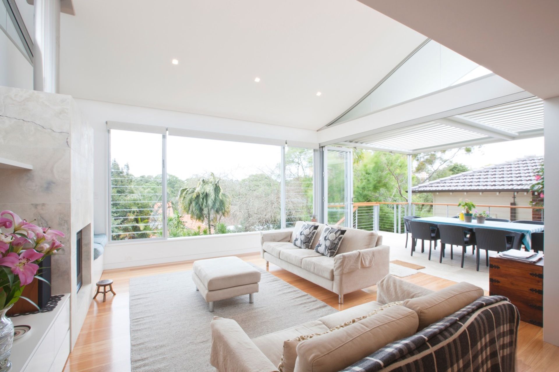 new living area addition with curved roof and adjoining covered elevated deck