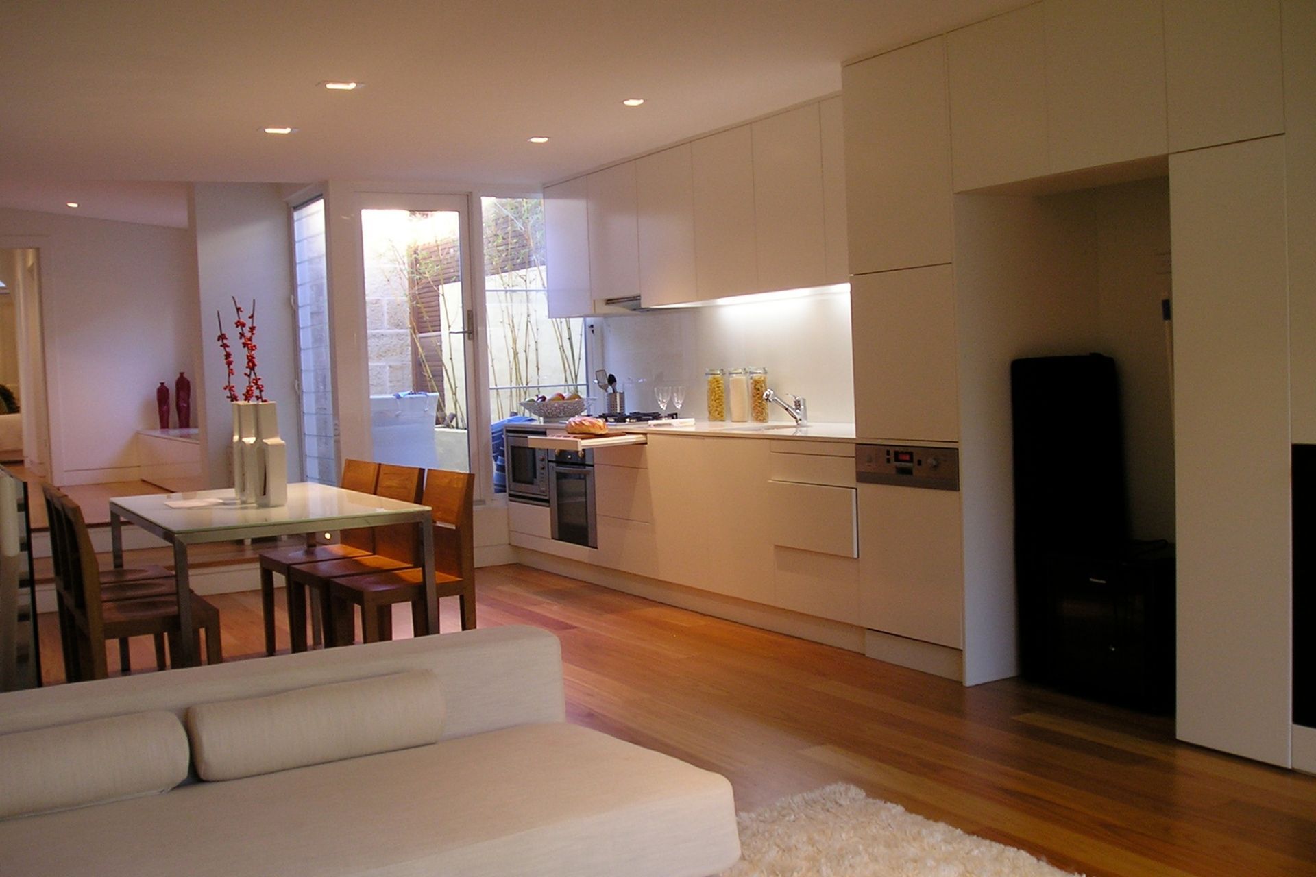 Dining and kitchen areas and side courtyard beyond