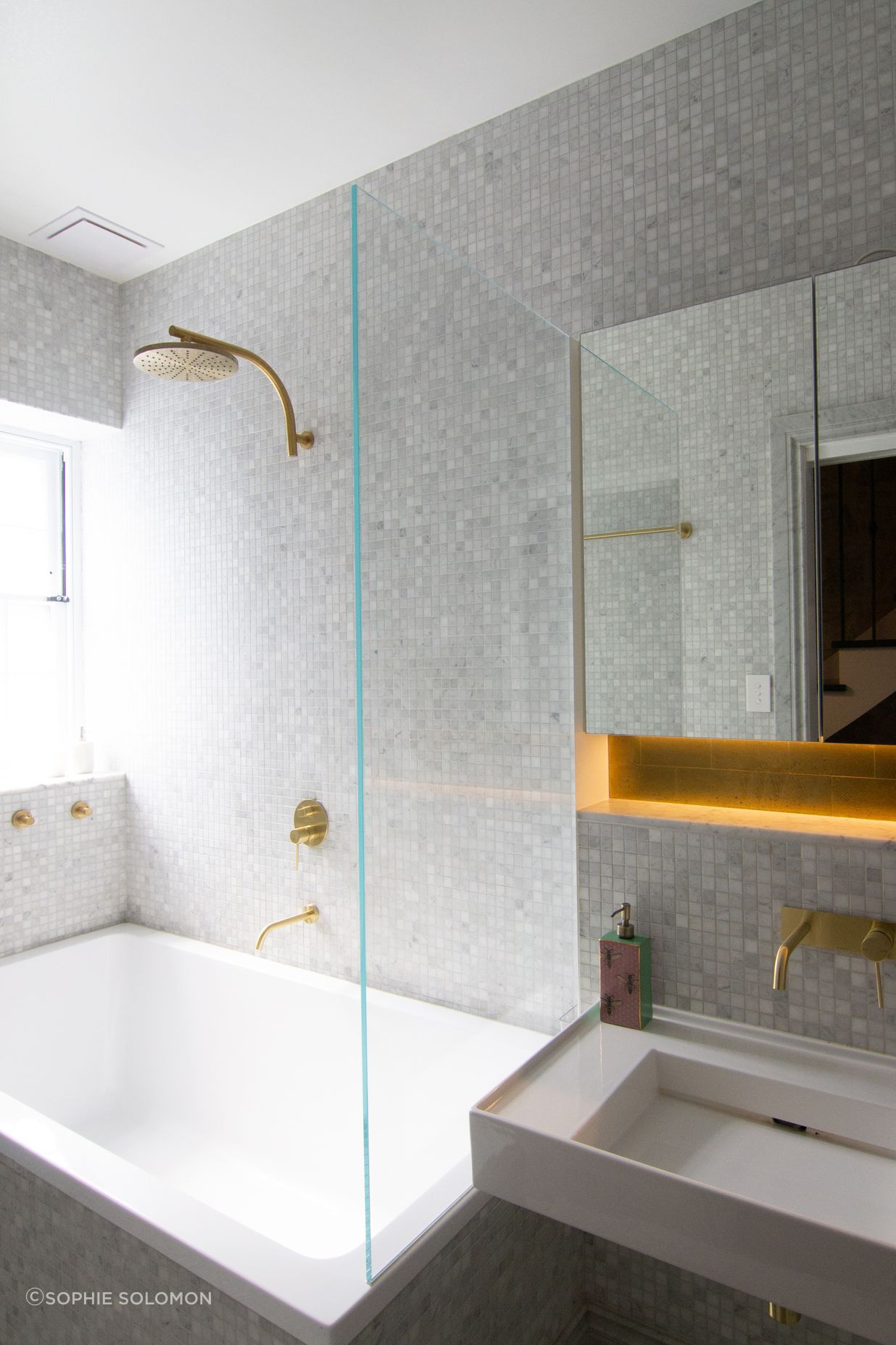 A textural bathroom to capture the textures of the heritage building. Brass classical fittings to compliment.