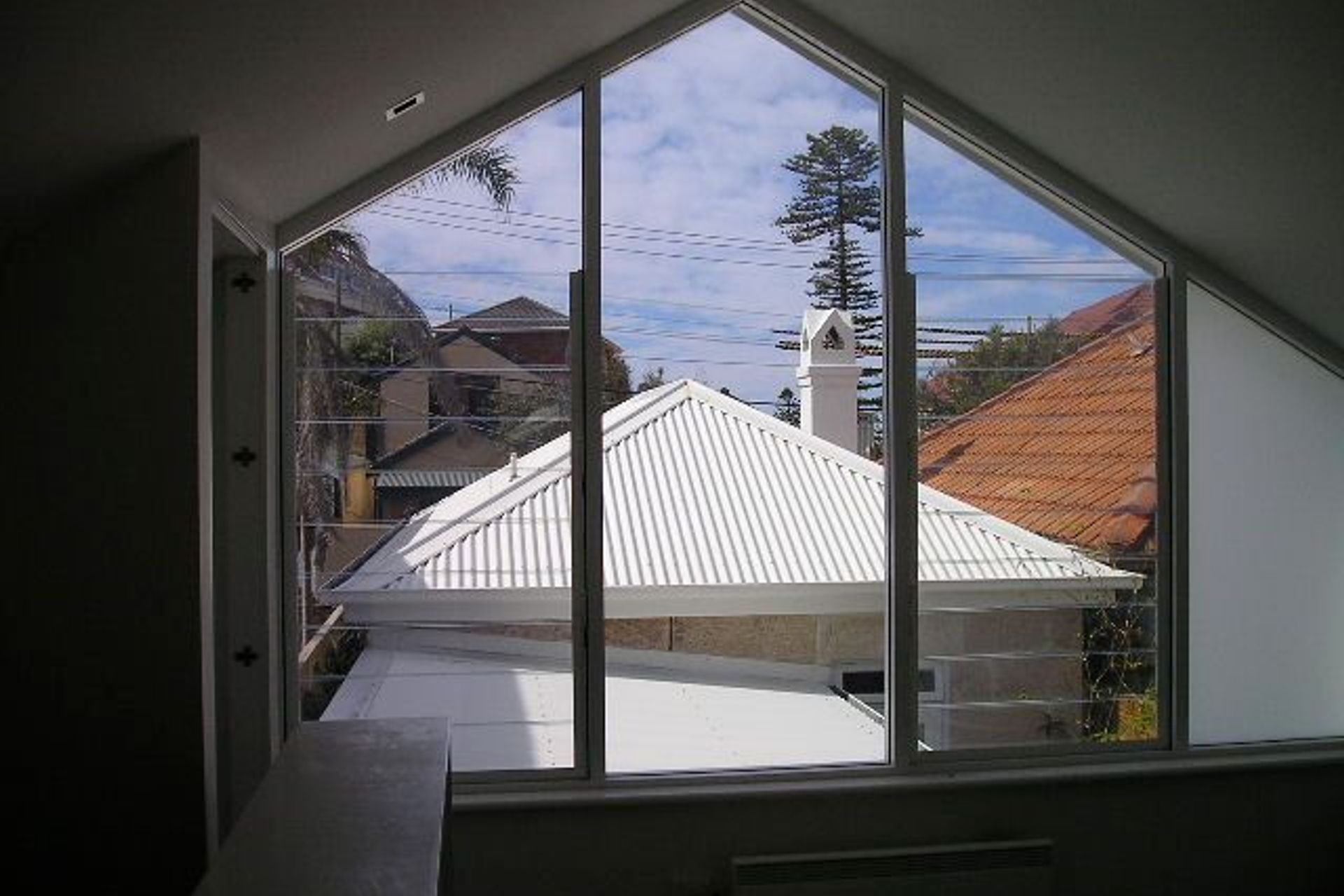 looking out over stone cottage from rear addition upper level