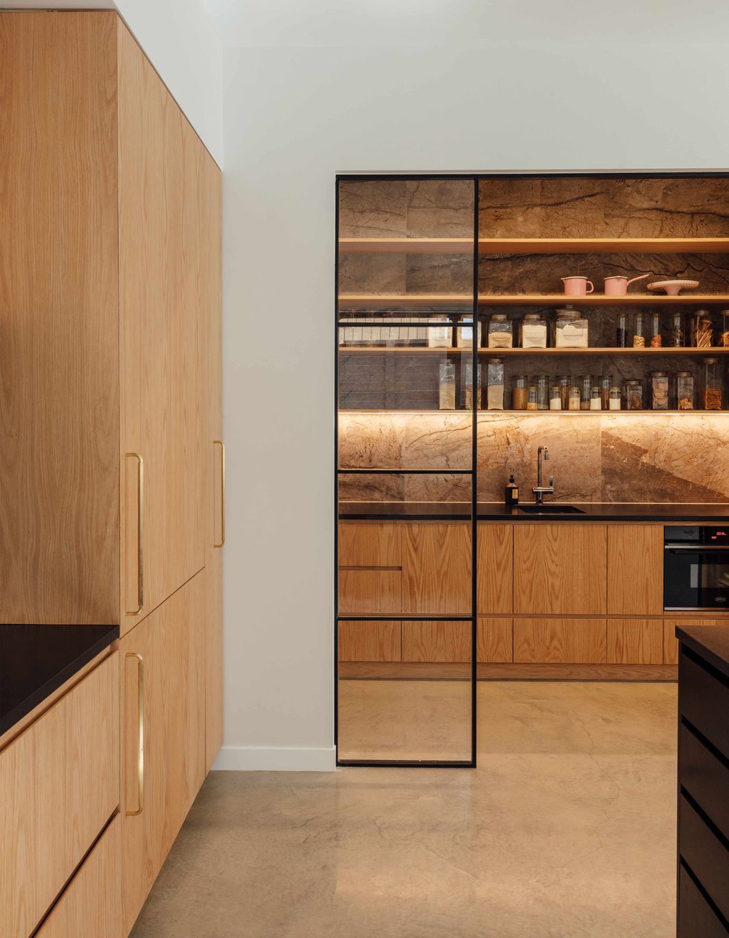 The butler’s pantry has the toaster, jug and blender on one side—to contain the morning mayhem—and a wine and cocktail making station on the other.