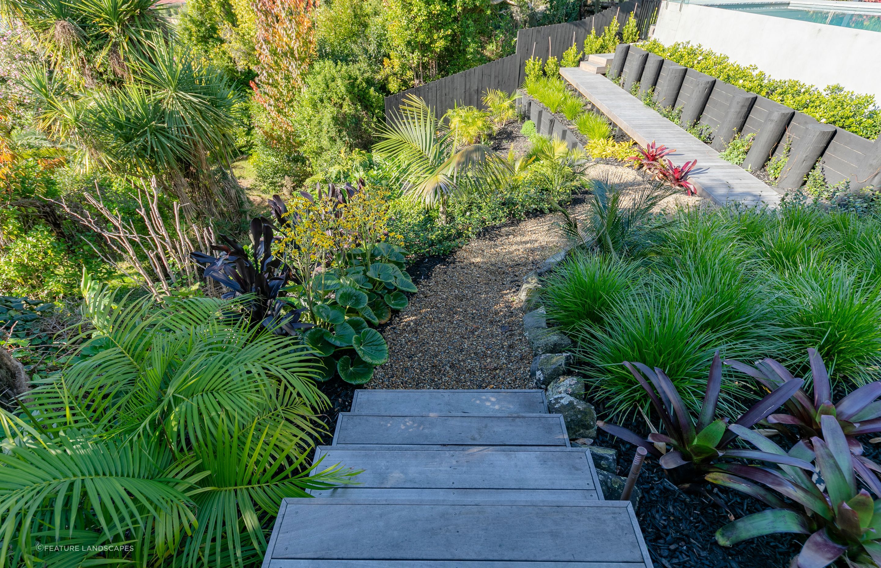 The beautiful wider landscape expertly put together by the team at Feature Landscapes enhances the overall pool &amp; landscape