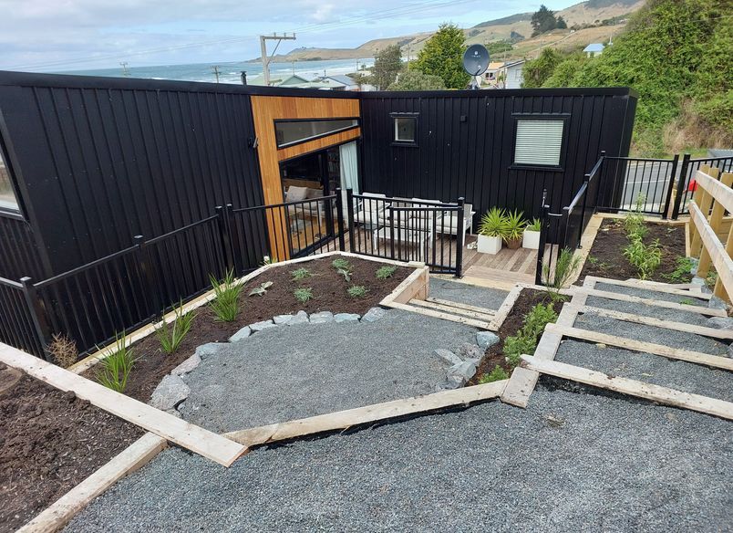 Maximising space and views on small, steep seaside section