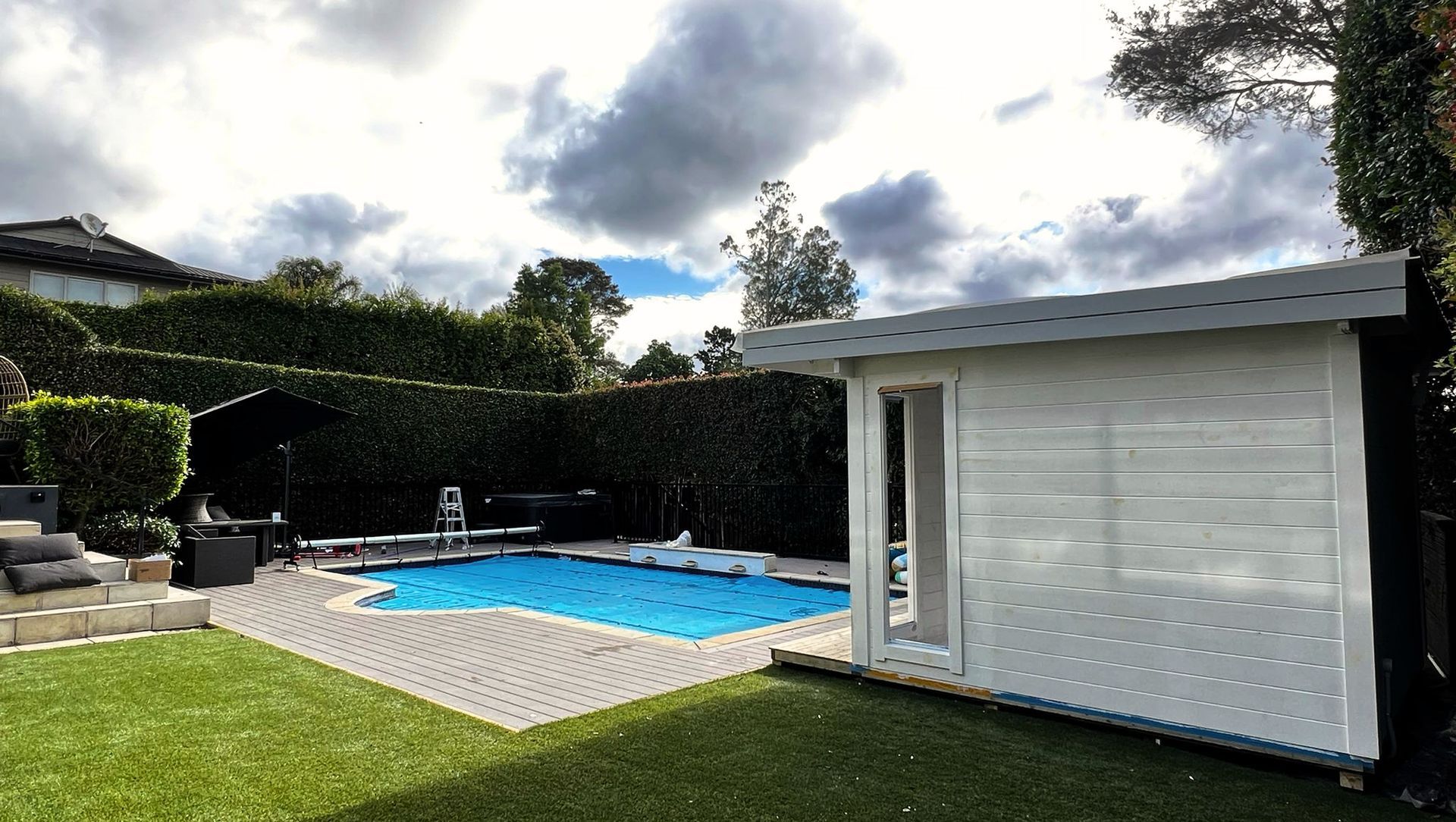 Pool deck with home office cabin banner