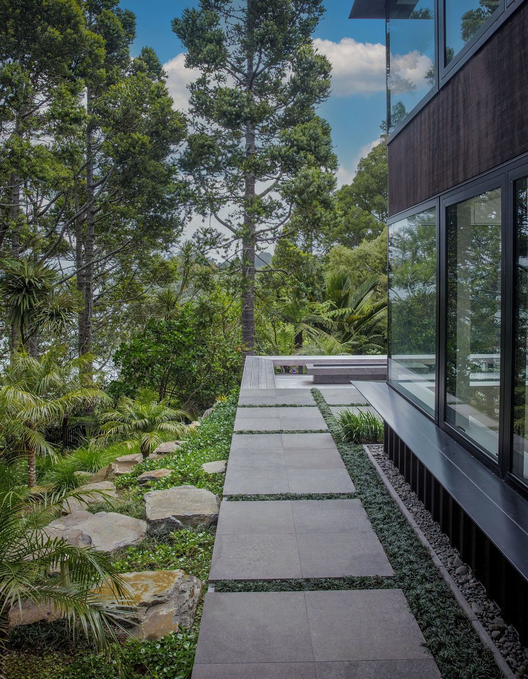 Stone paved side path, hardwood deck and fire pit.