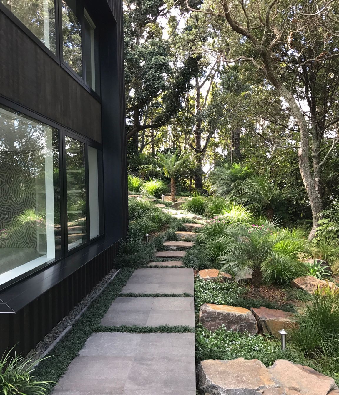 Stone pavers, stepping stones with native/subtropical planting