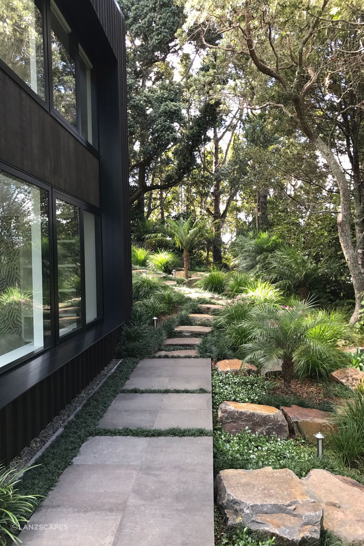 Stone pavers, stepping stones with native/subtropical planting