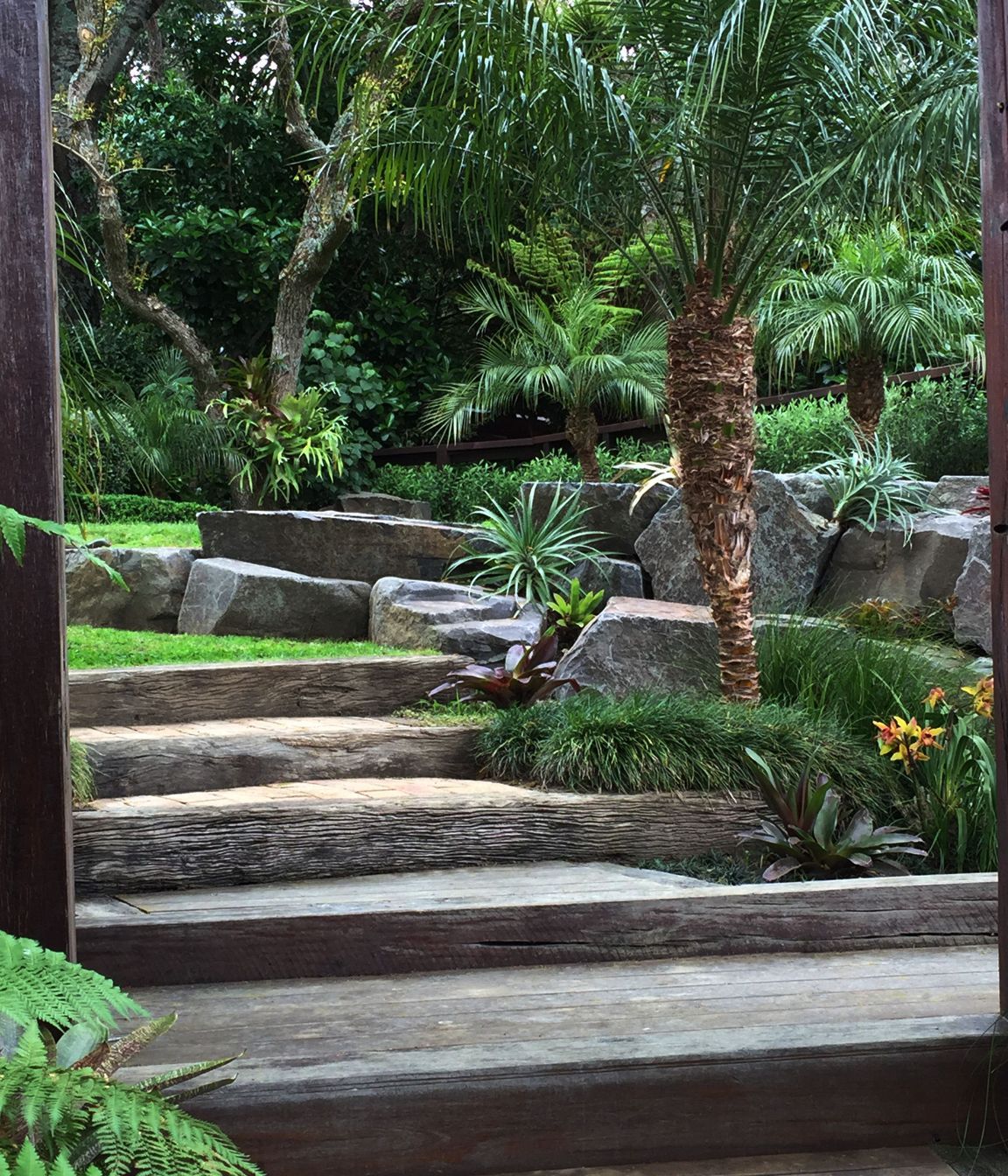 Rock retaining, hardwood sleeper steps and subtropical/native plantings