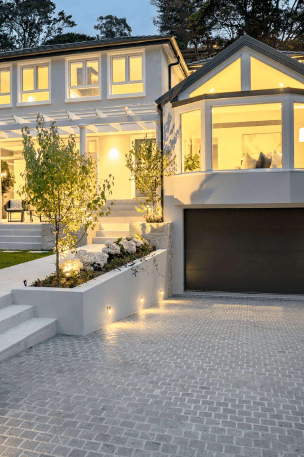 Silhouette Grey Granite Cobblestones driveway at Mosman family residence by hecticrAt architects.
