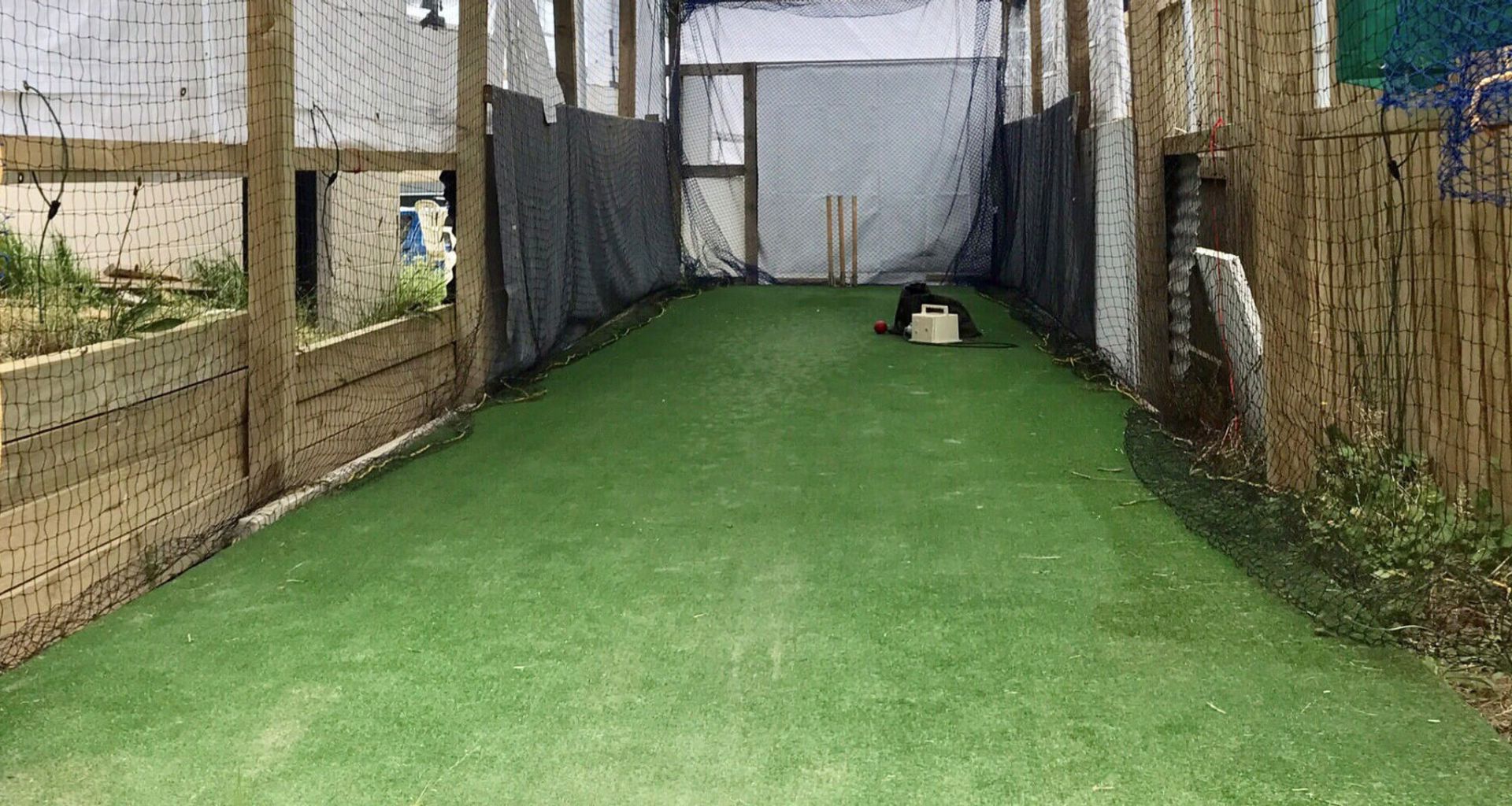 A cricket practice facility on home turf banner
