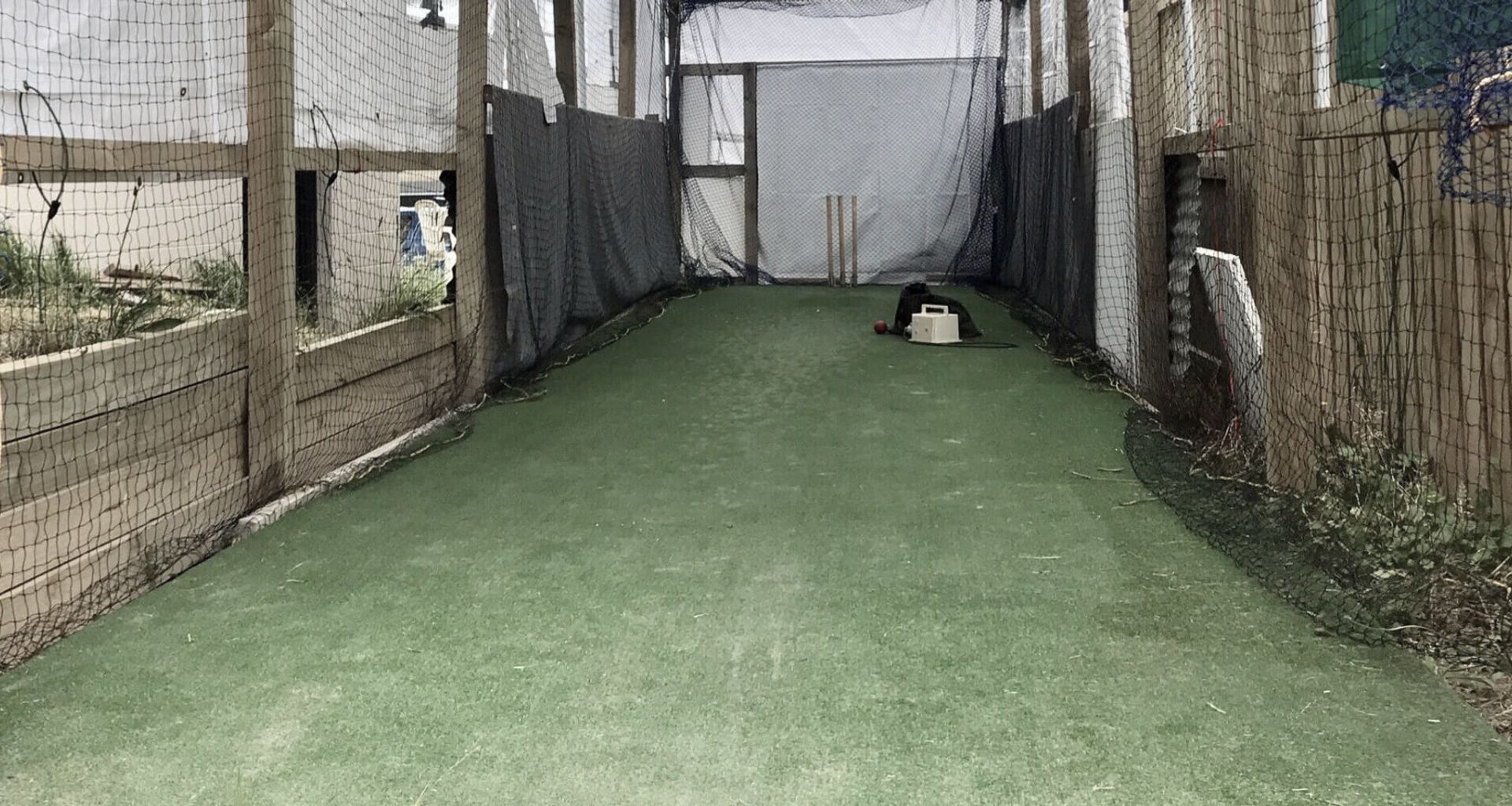 A cricket practice facility on home turf banner