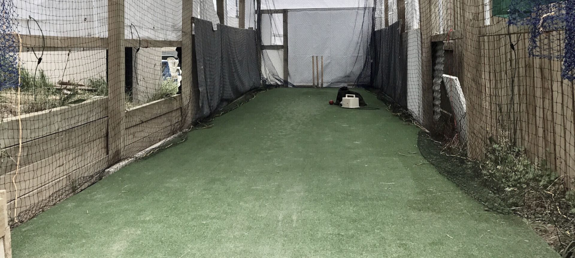 A cricket practice facility on home turf banner