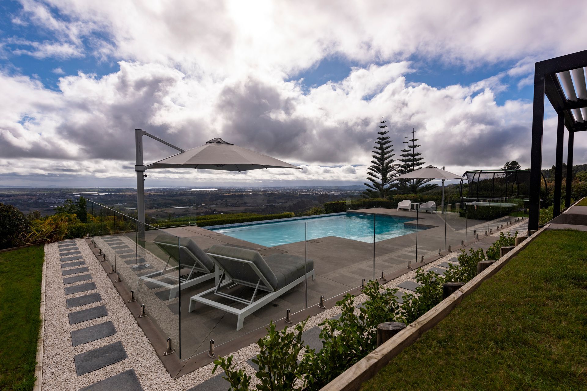 Using the lay of the land this pool features a Horizon Edge