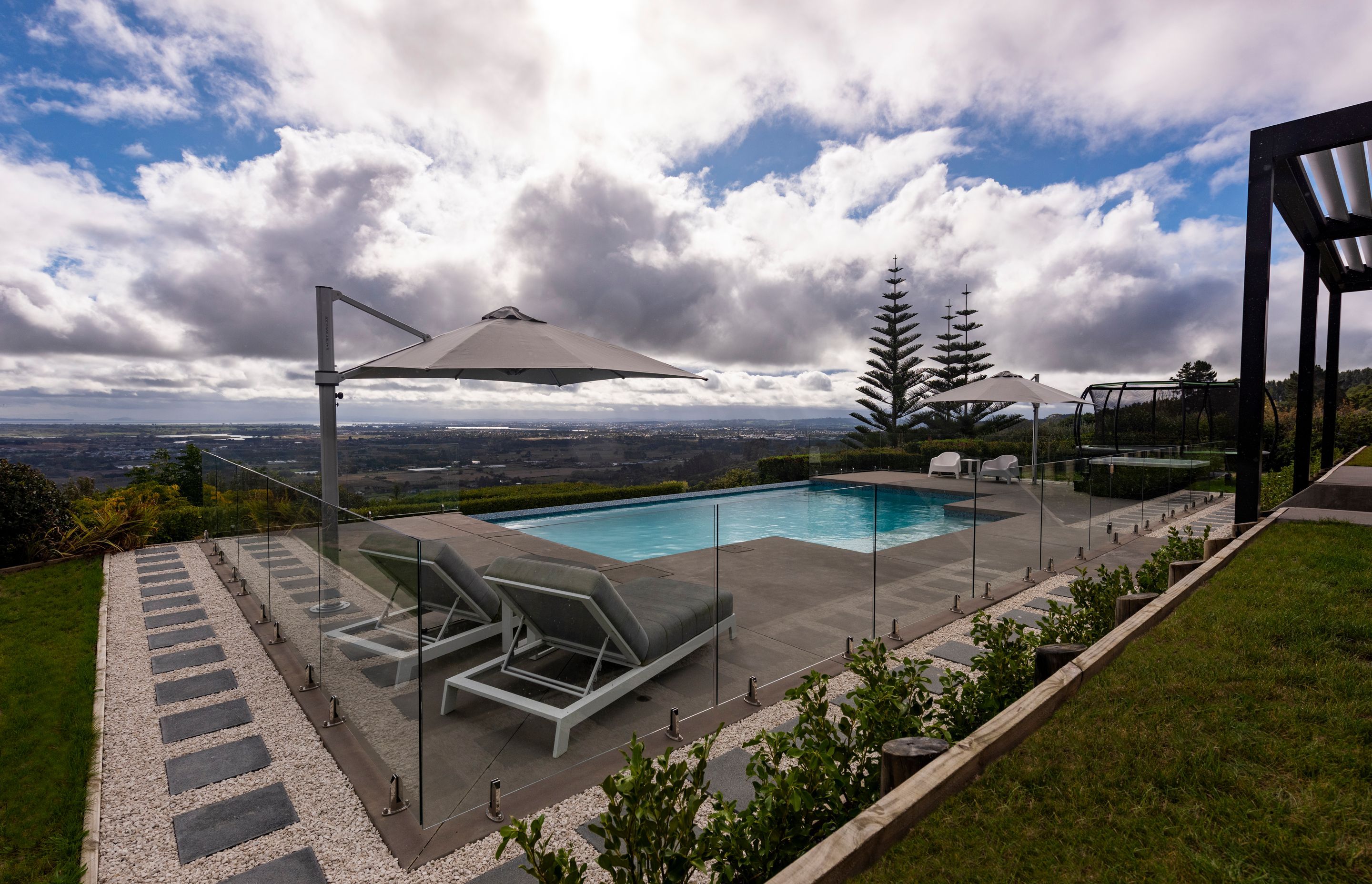 Using the lay of the land this pool features a Horizon Edge