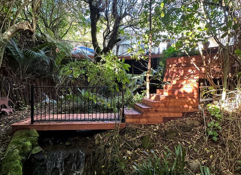 Deck Integrated with Native Bush and Built Over a Stream