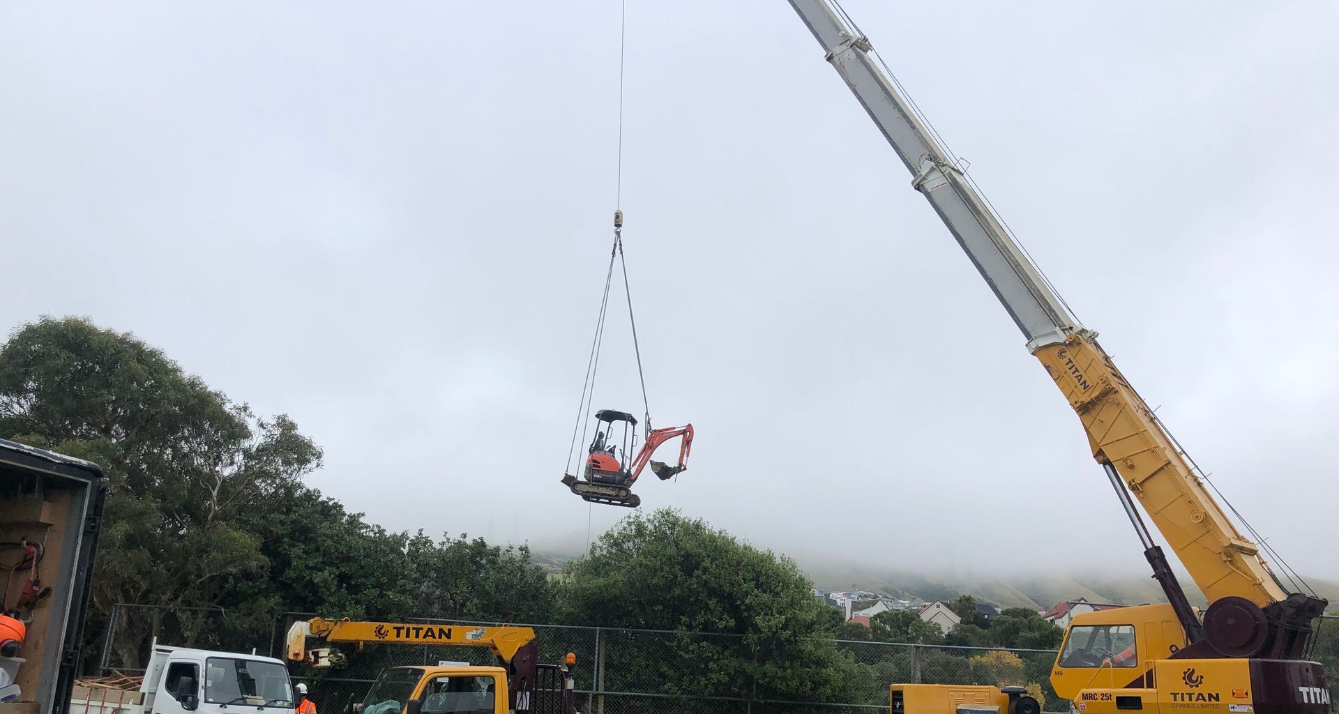 Helicopter - Crane lifts banner