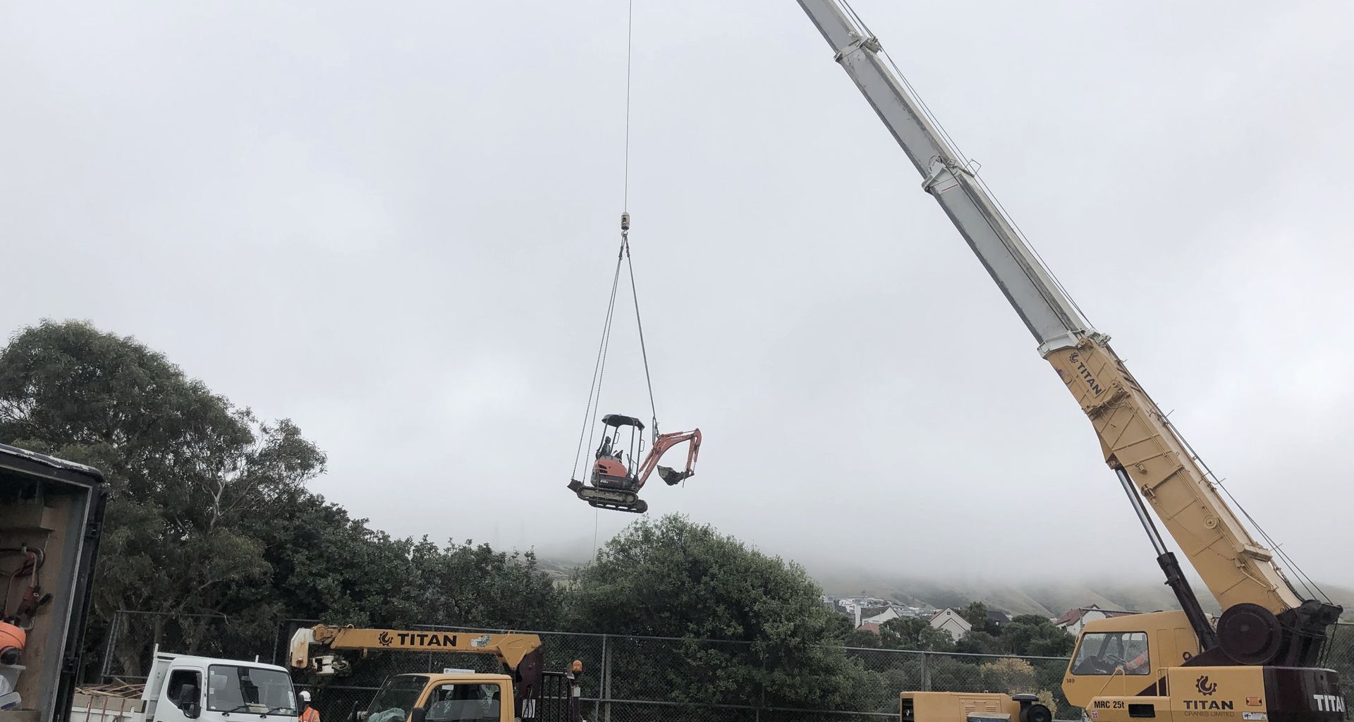 Helicopter - Crane lifts banner