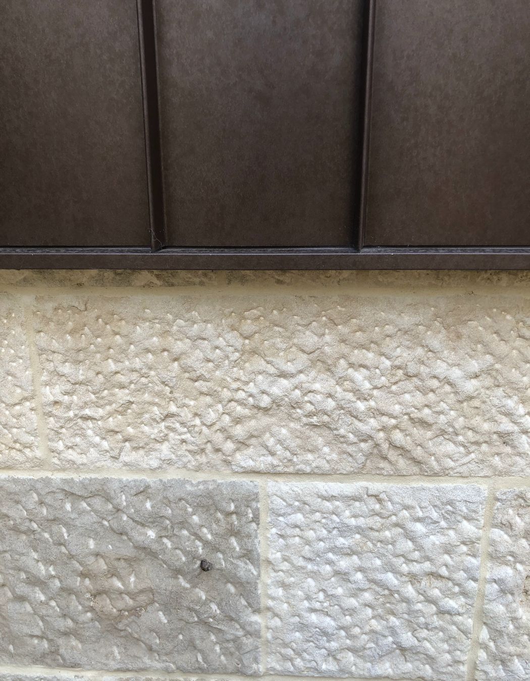 Close up of the beautiful stone and corten facade.