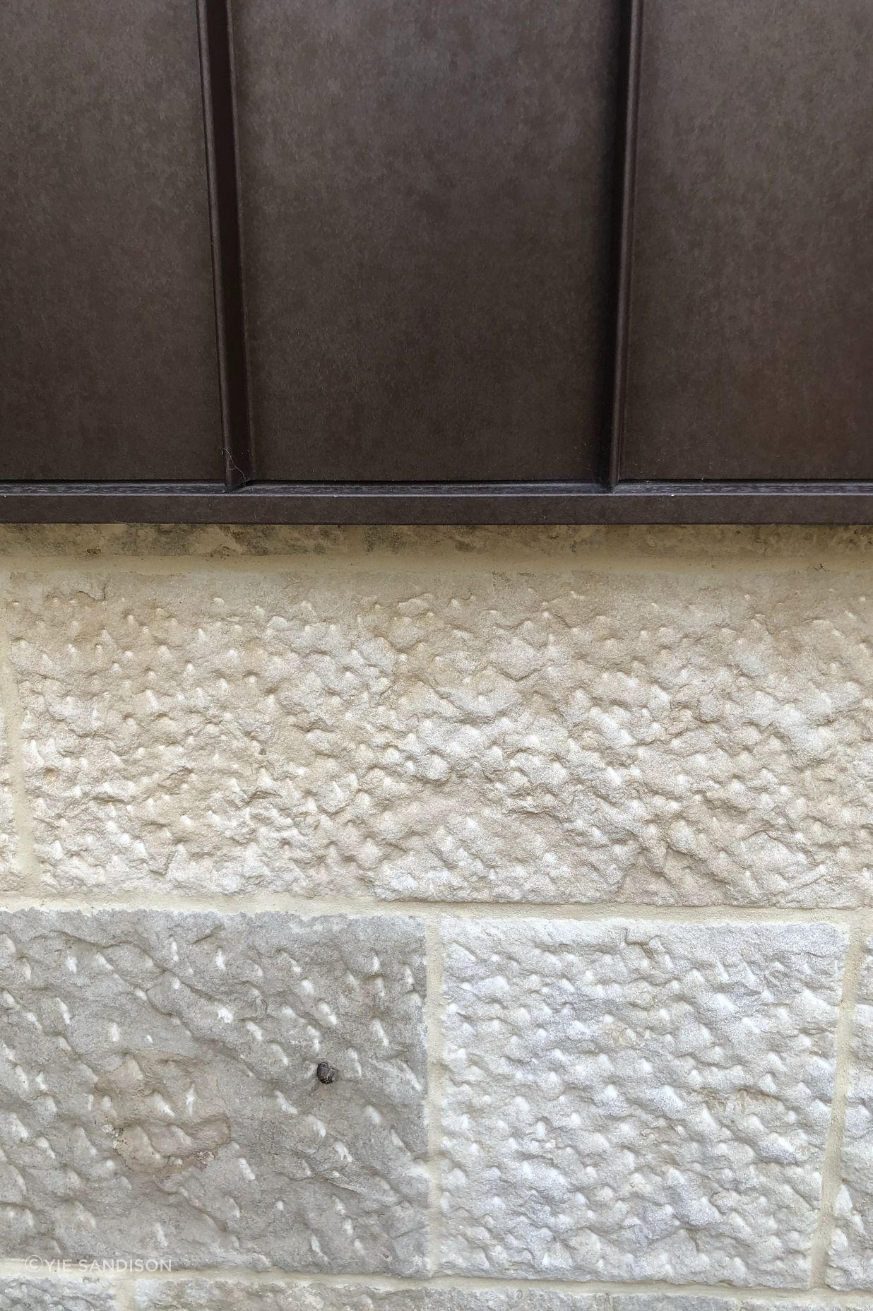 Close up of the beautiful stone and corten facade.