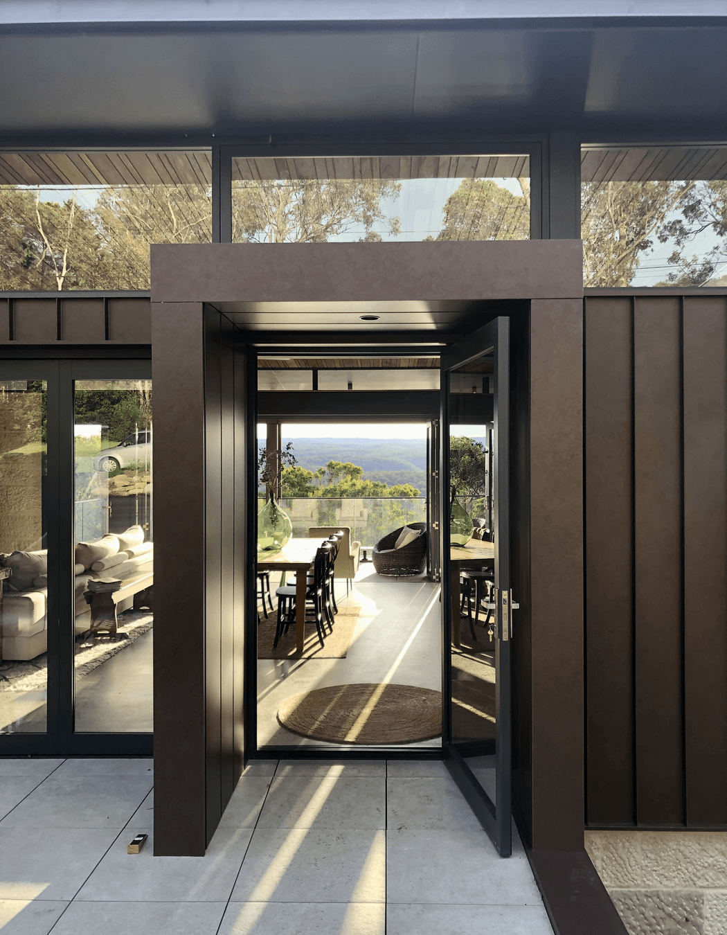The corten entry portal transports you to a world of green and peace.