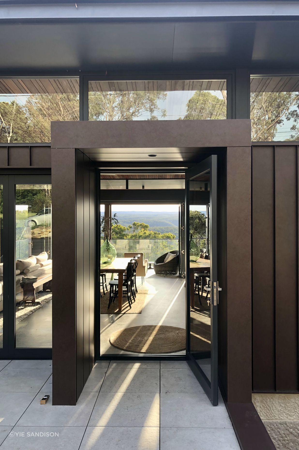 The corten entry portal transports you to a world of green and peace.