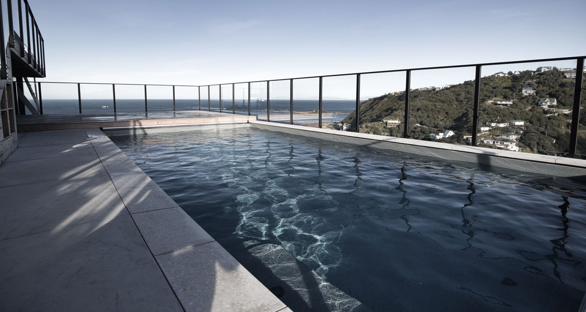 Hillside pool above Wellington banner