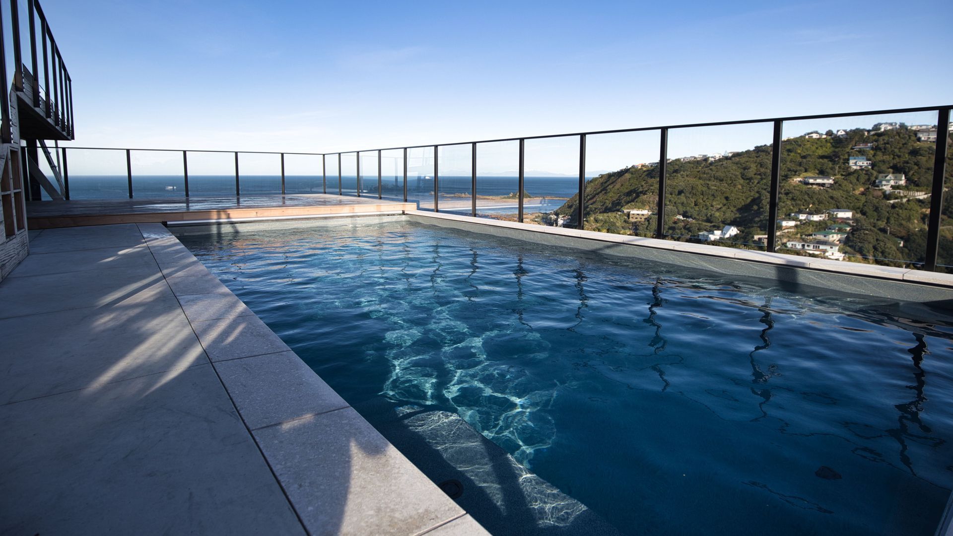 Hillside pool above Wellington banner