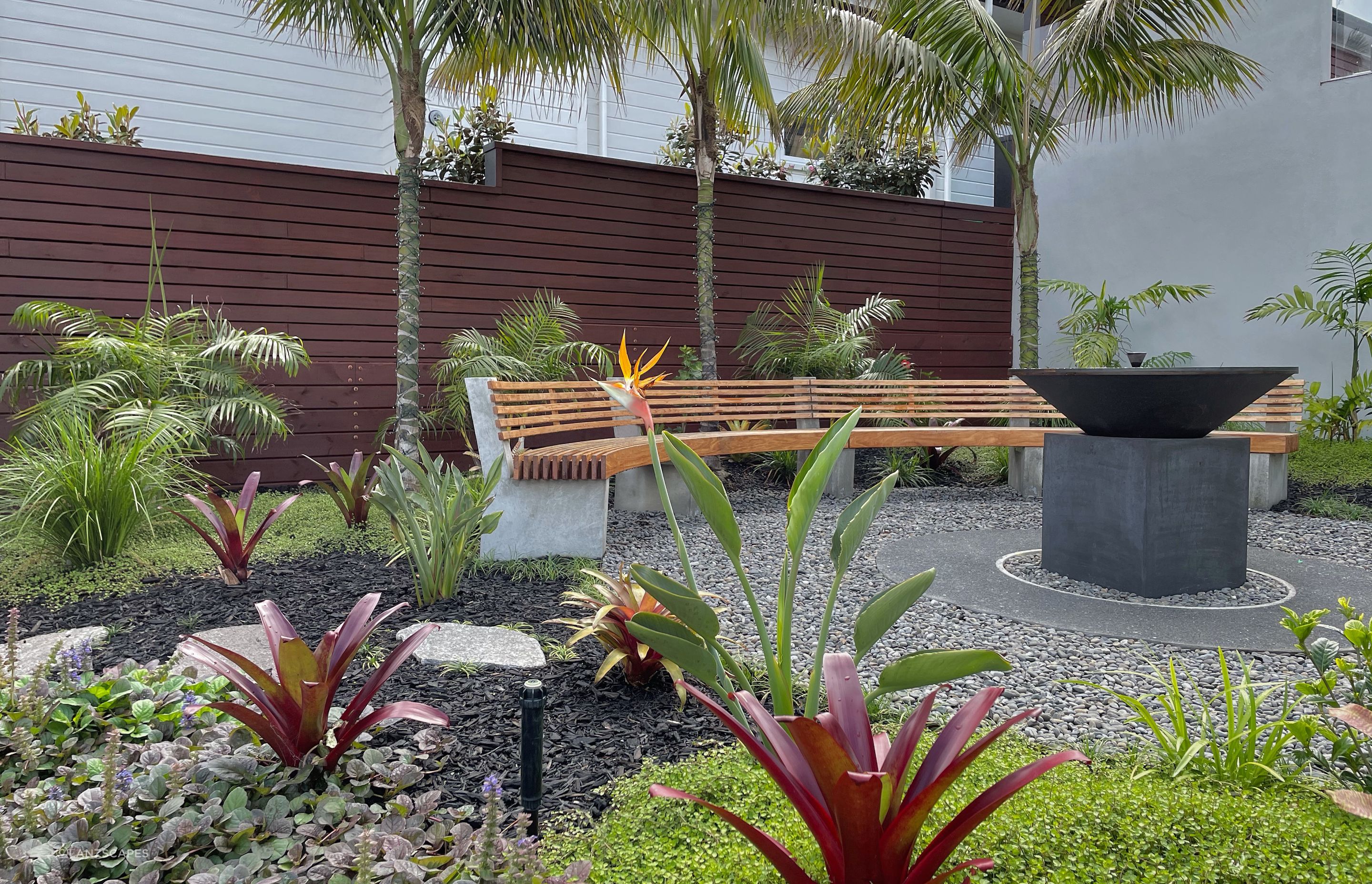 Garden with fire pit and curved seating