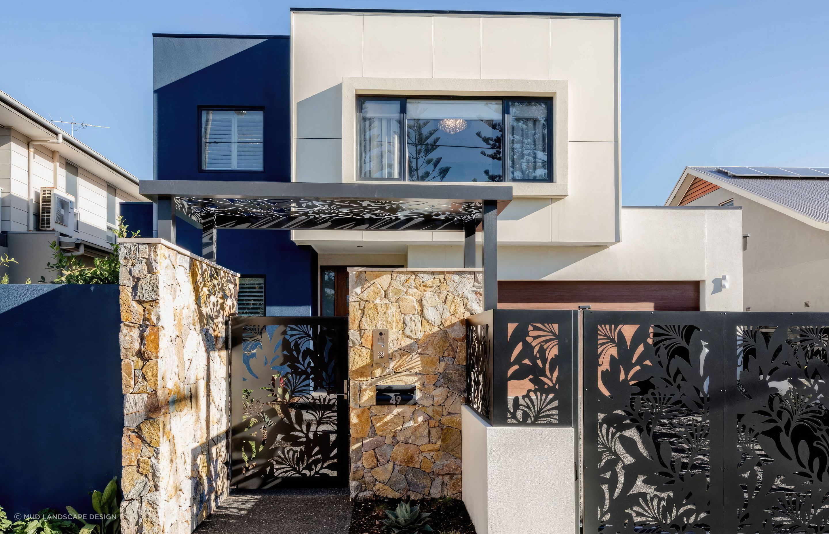 upBar-Beach-Urban-Oasis-Entry-with-custom-laser-cut-screening-and-handmade-stone-faced-entry-wall-scaled-fix-standard-scale-200x-v3.jpg