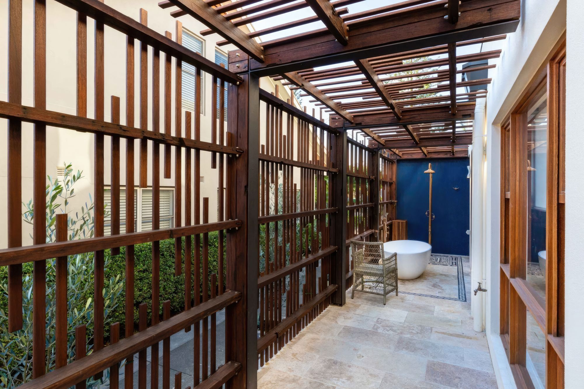 upBar-Beach-Urban-Oasis-Screened-outdoor-shower-area-and-bath-scaled-fix-standard-scale-200x.jpg