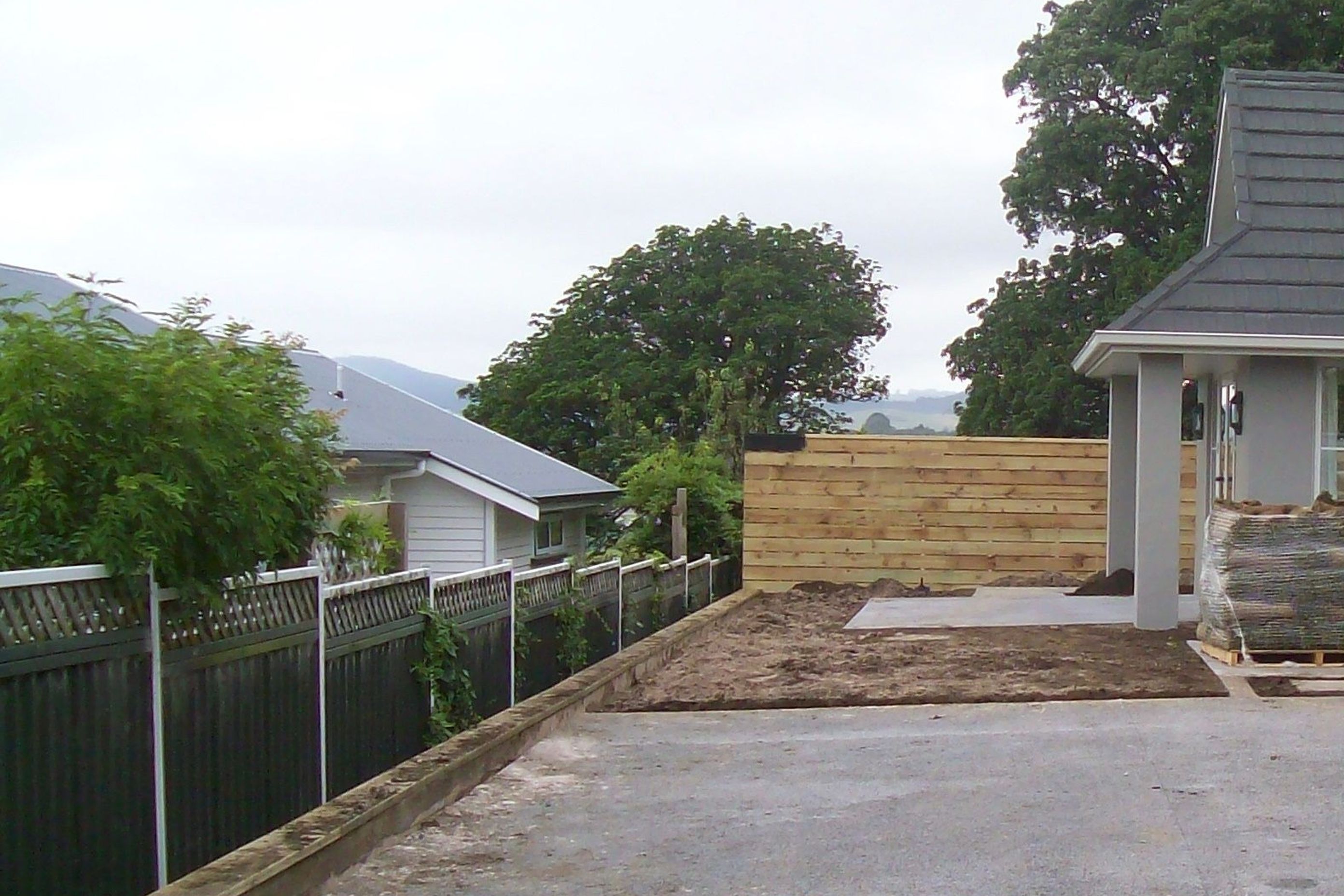 BEFORE - From this, an ugly fence, a large uninspiring concrete expanse, and a view into the neighbours