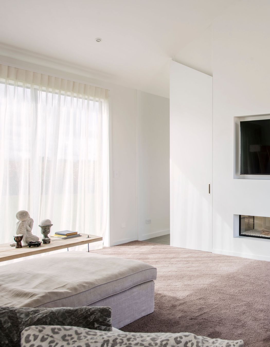 Tucked away behind the open-plan living area, the lounge provides a more secluded living space.