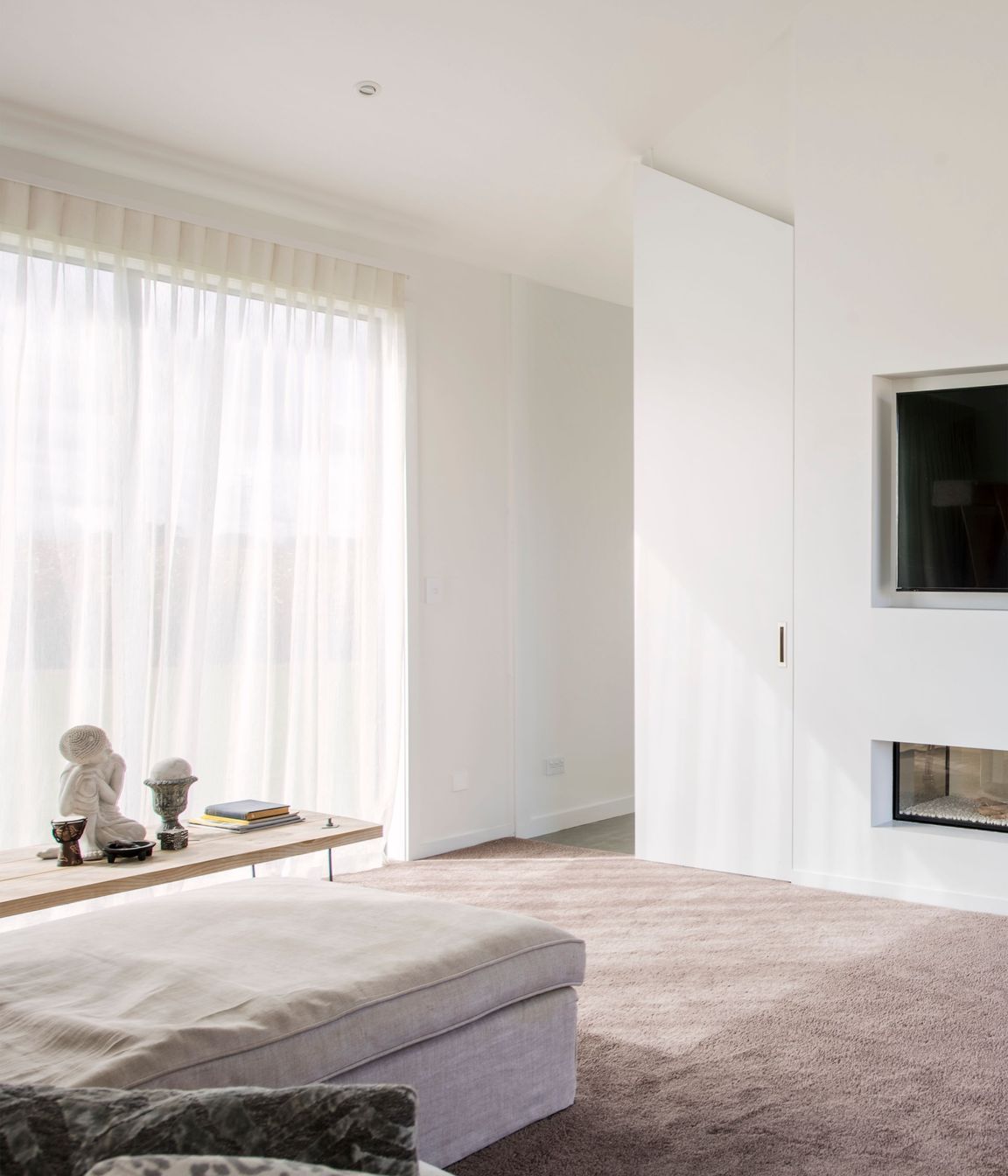 Tucked away behind the open-plan living area, the lounge provides a more secluded living space.