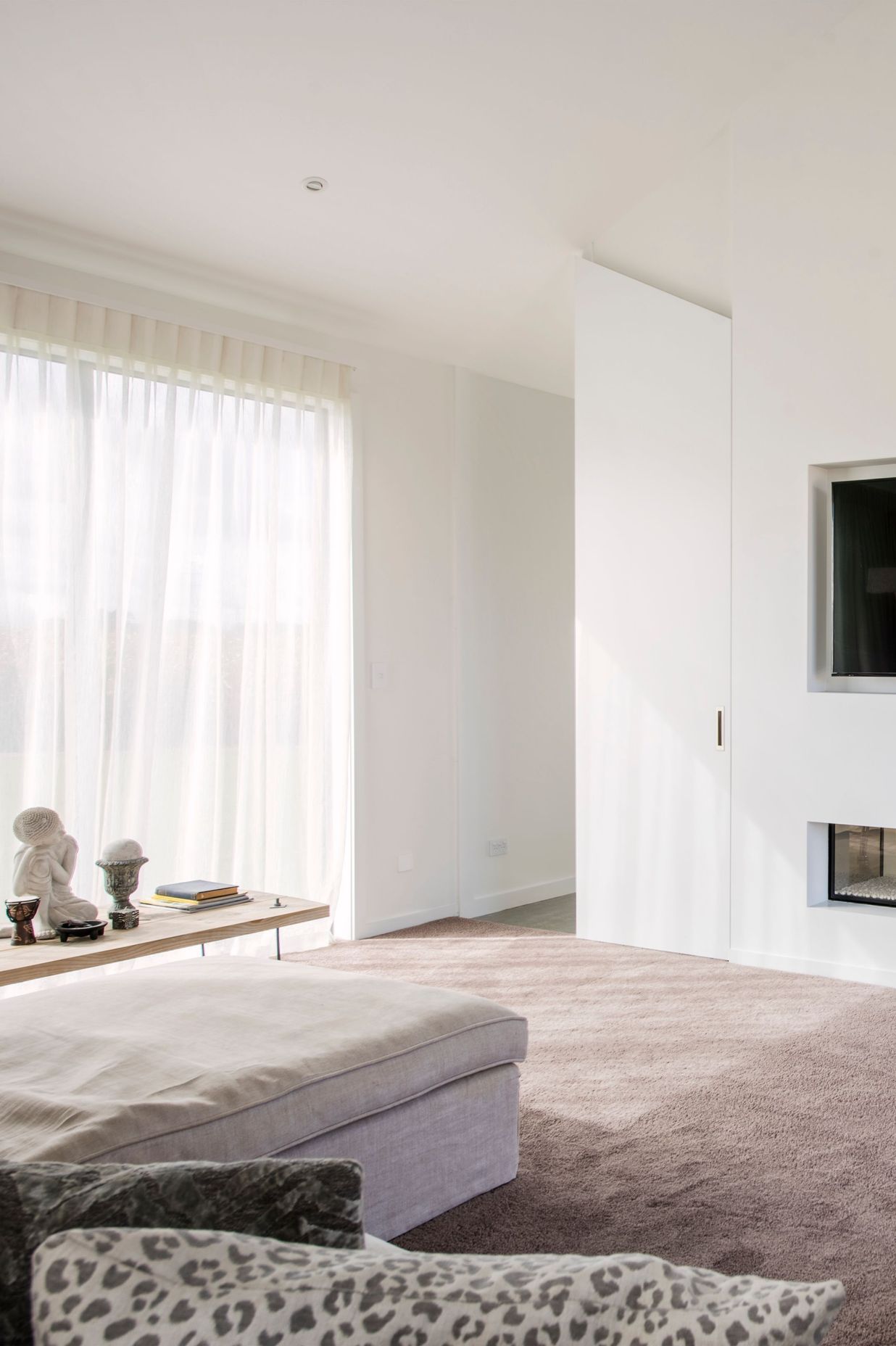 Tucked away behind the open-plan living area, the lounge provides a more secluded living space.