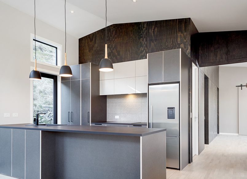 A striking feature wall in black satin plywood