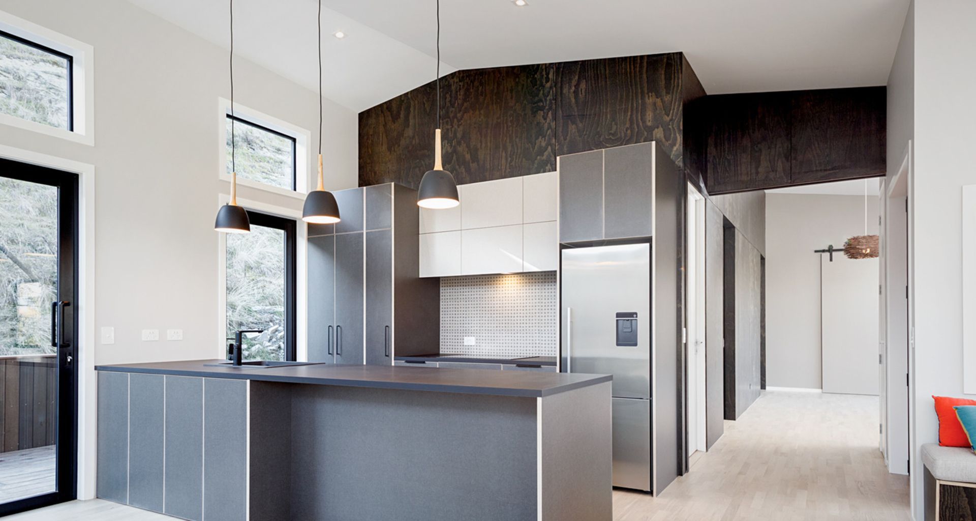 A striking feature wall in black satin plywood banner