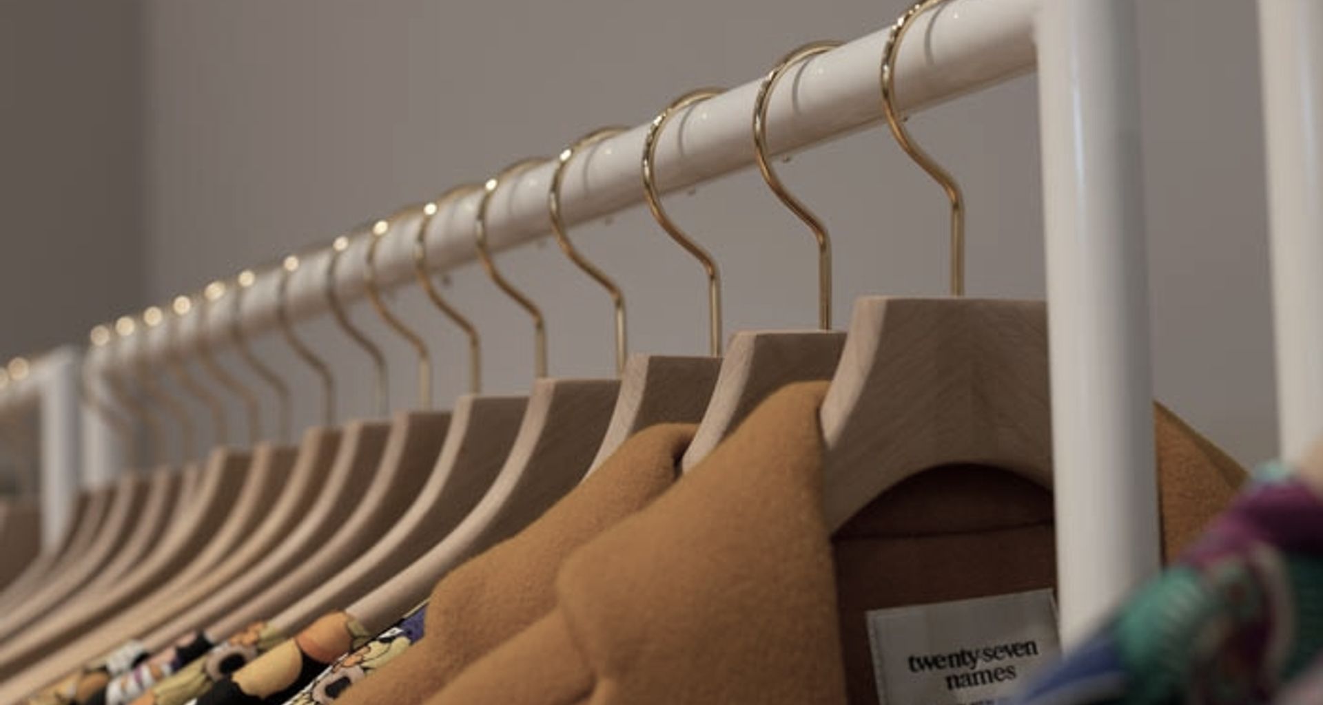 twenty-seven names - retail clothing racks banner